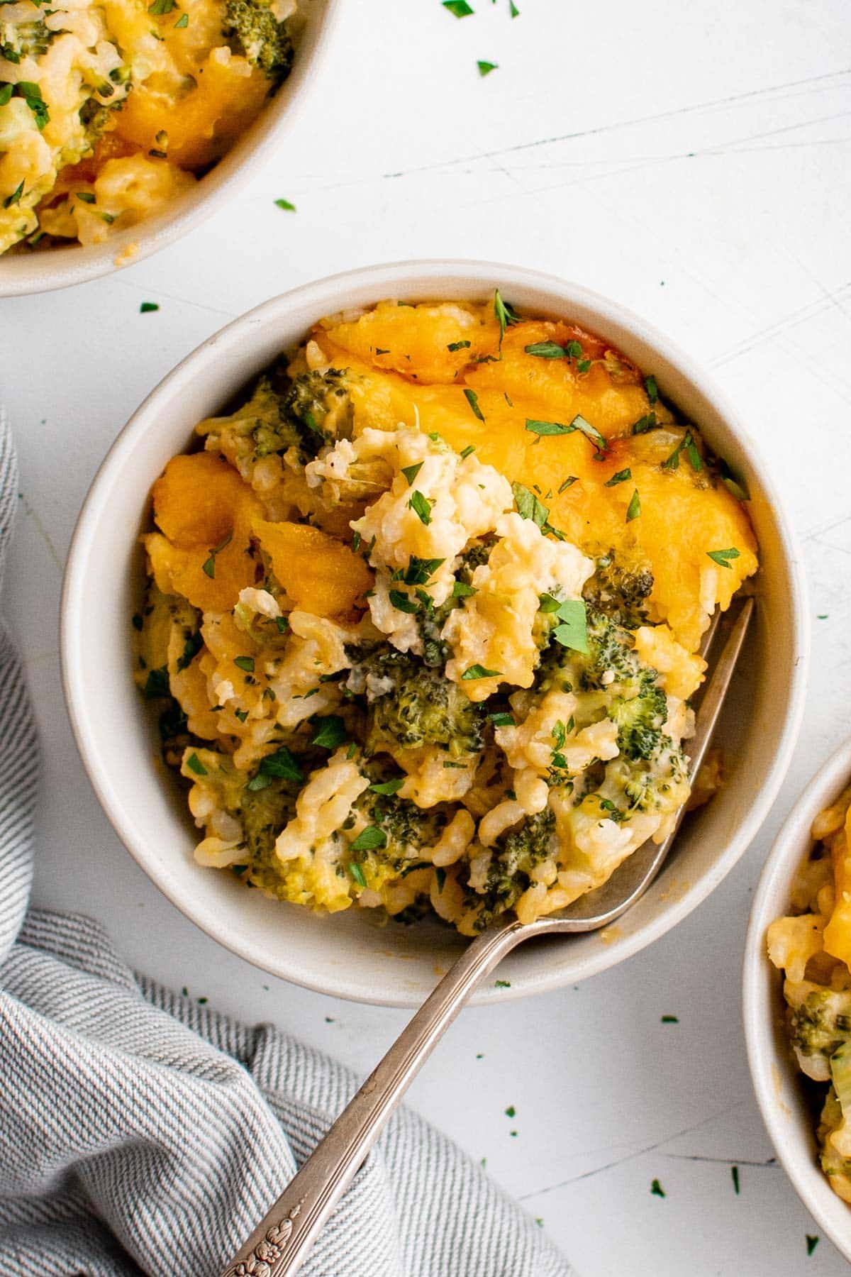 bowl of broccoli and rice casserole with a fork