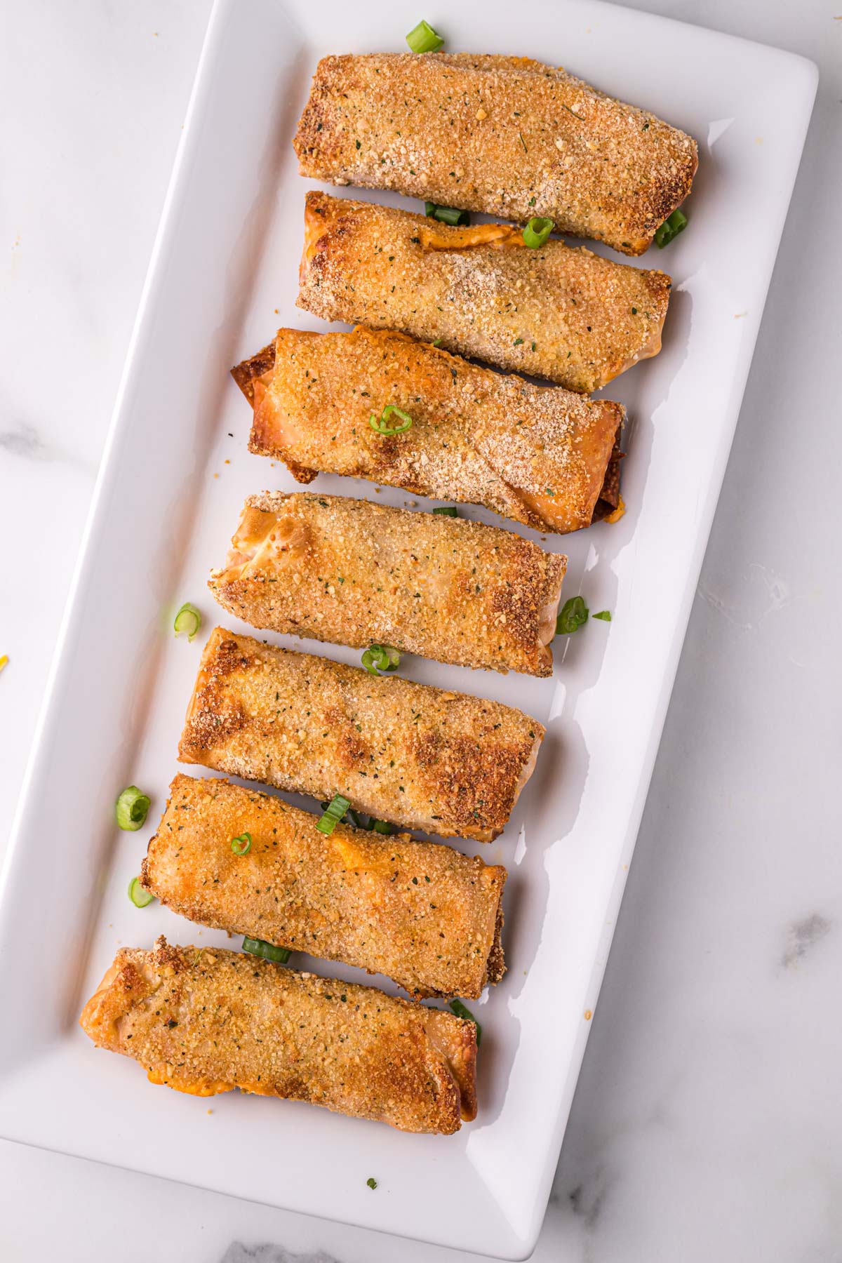 air fried egg rolls on a white platter