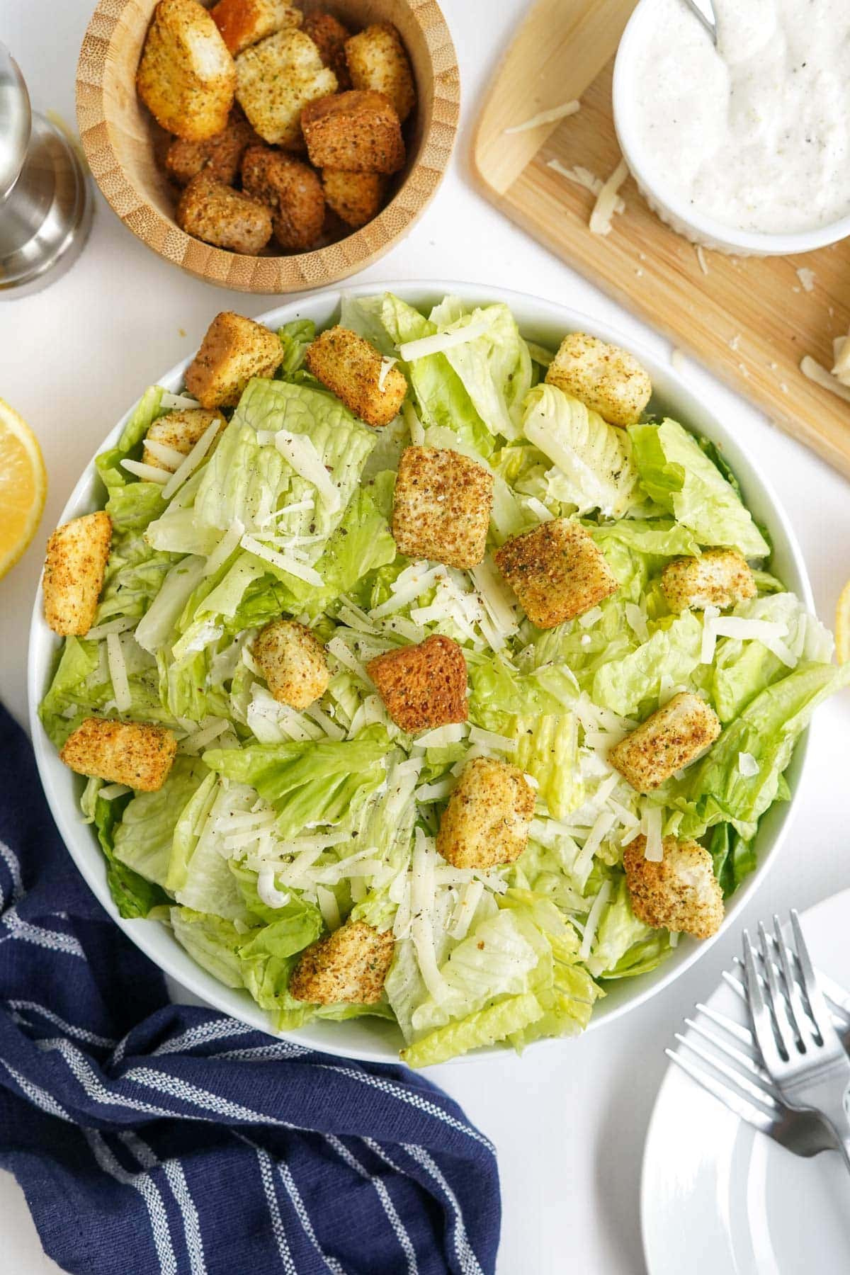 caesar salad in a white bowl