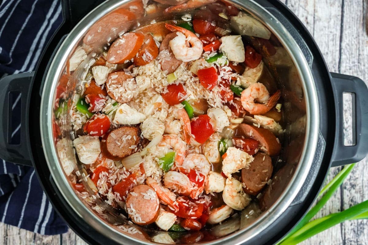 rice, sausage, shrimp , chicken and vegetables in instant pot