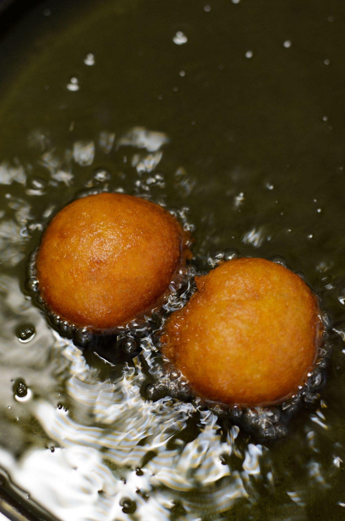 fritters deep frying in oil