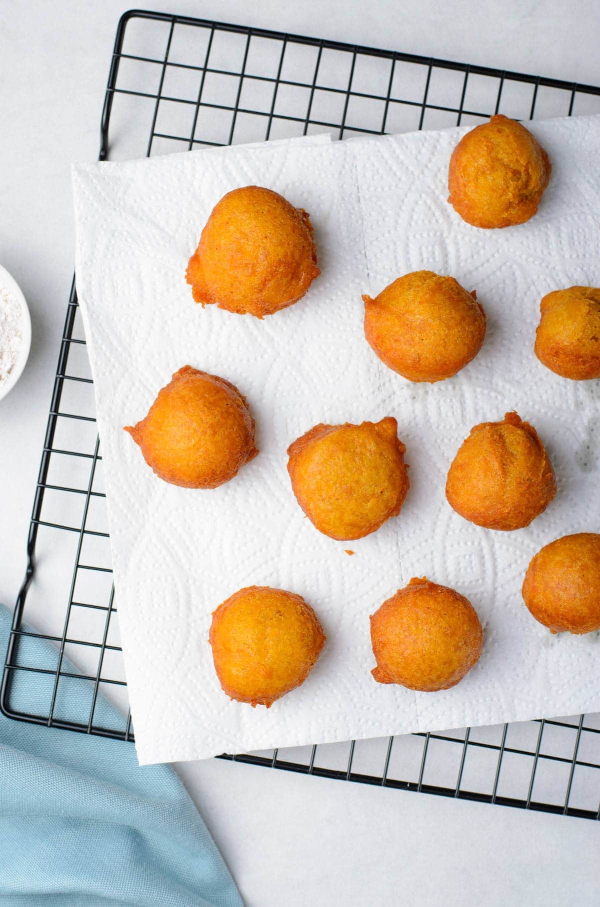 fritters on a paper towel and wire rack