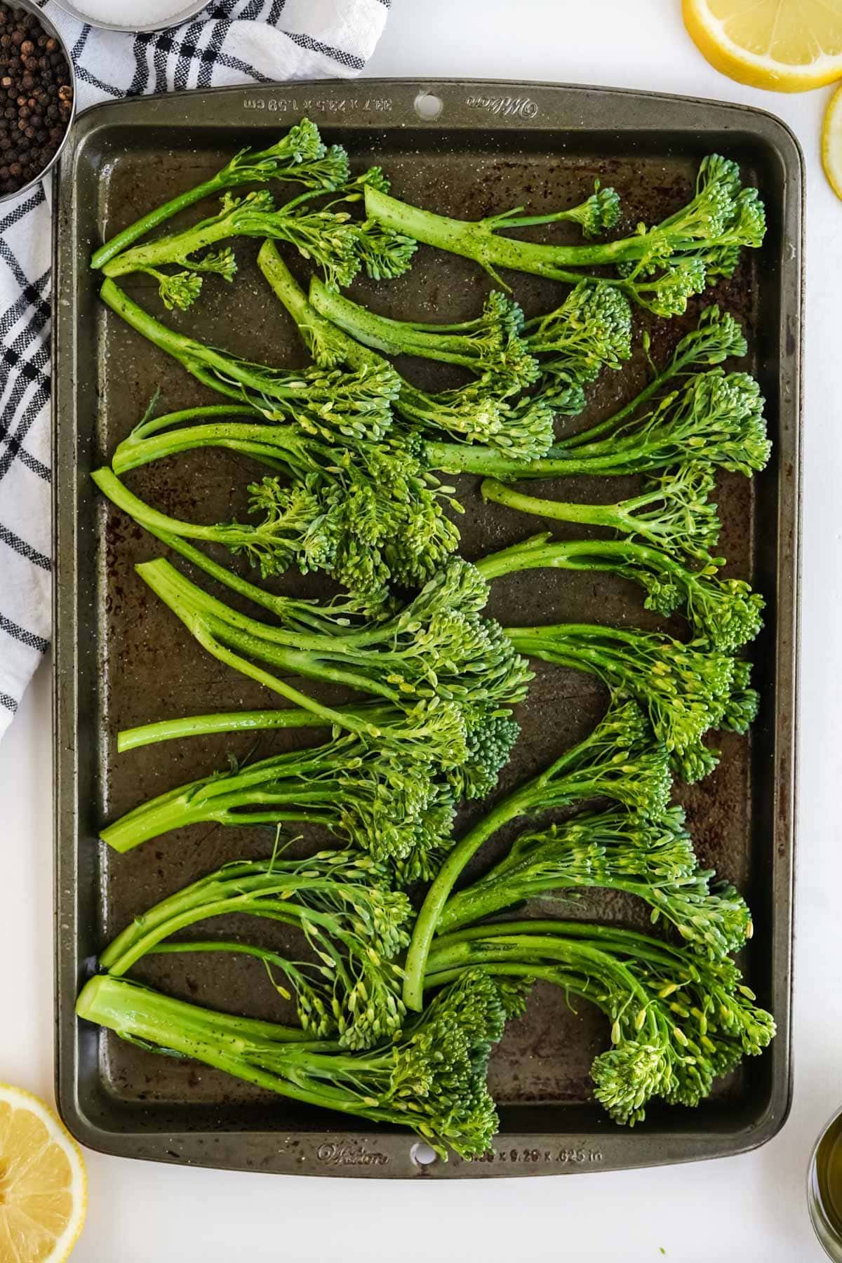 broccolini on a baking sheet