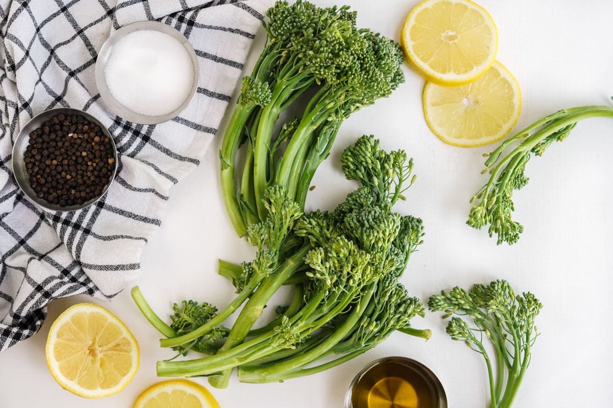 broccolini, salt, lemon slices, pepper