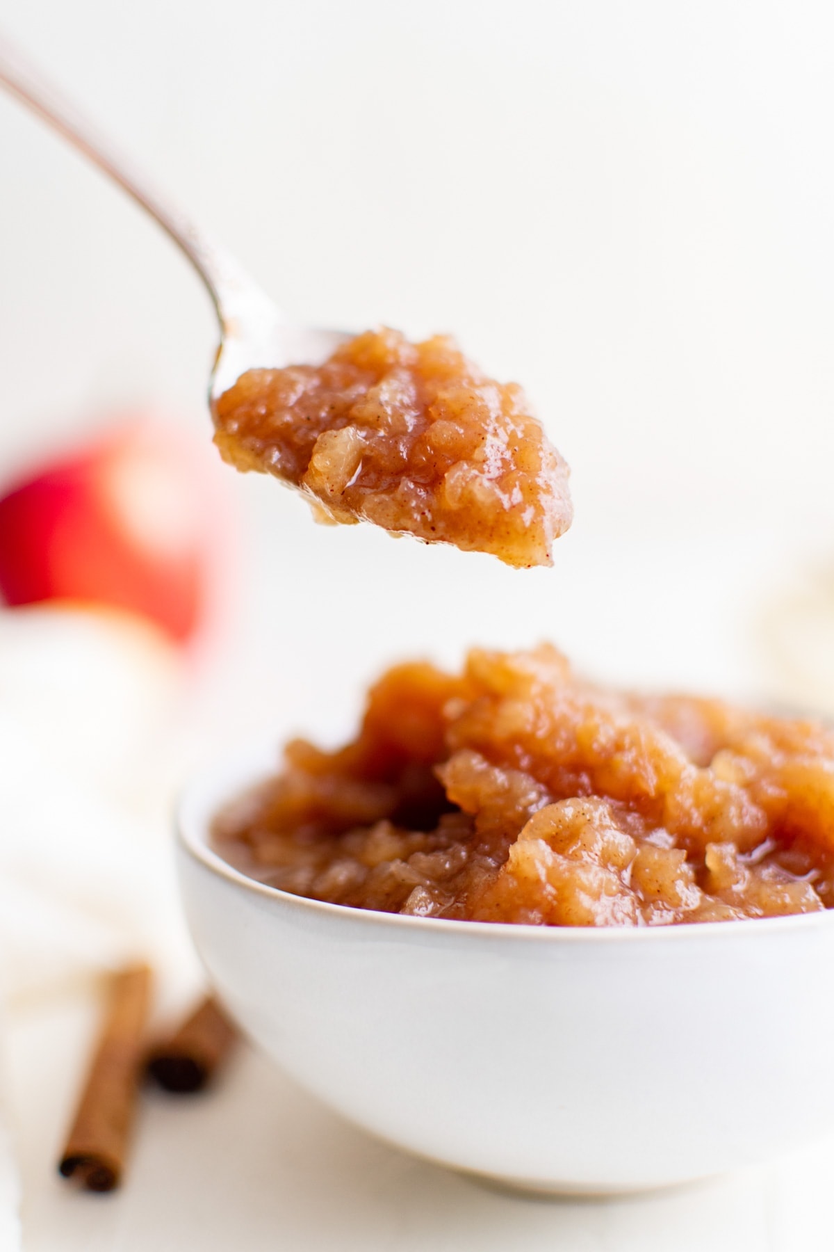 bowl of applesauce, spoon