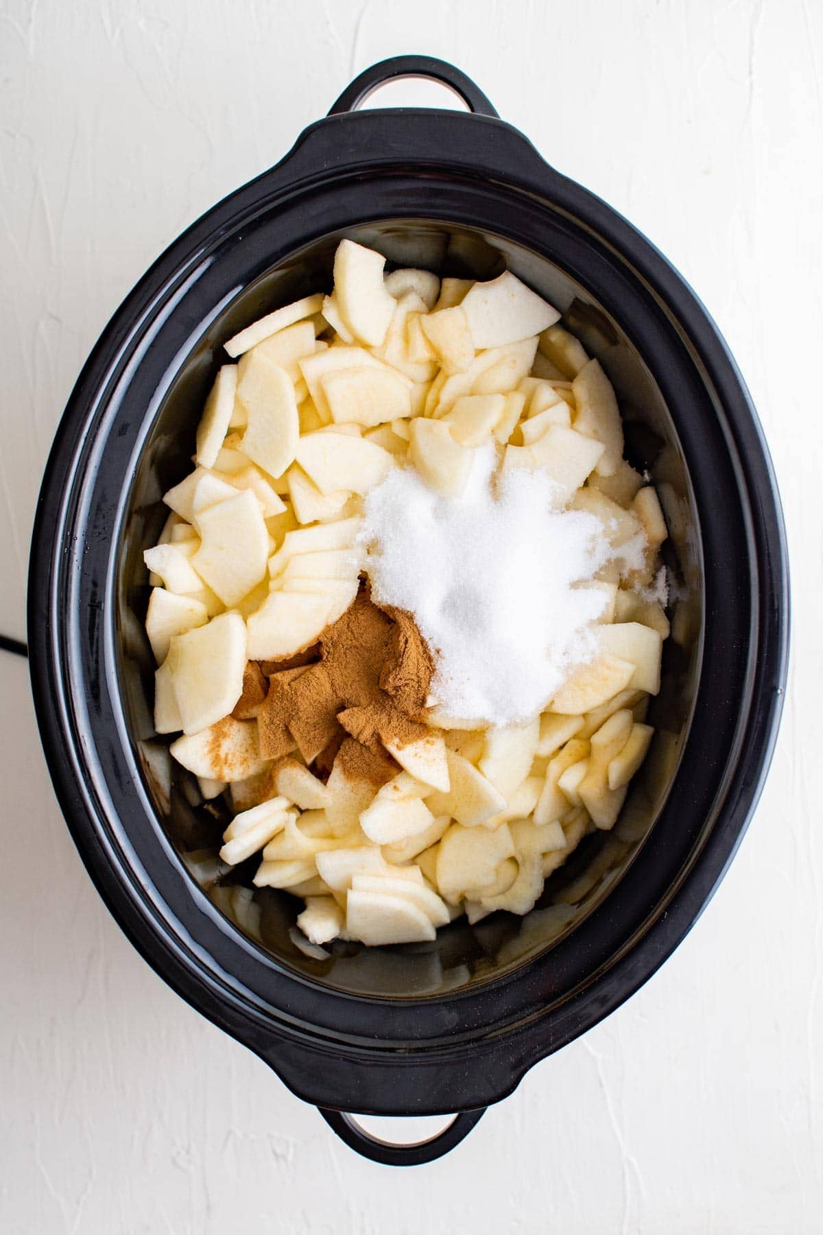 apples, cinnamon and sugar in a crock pot