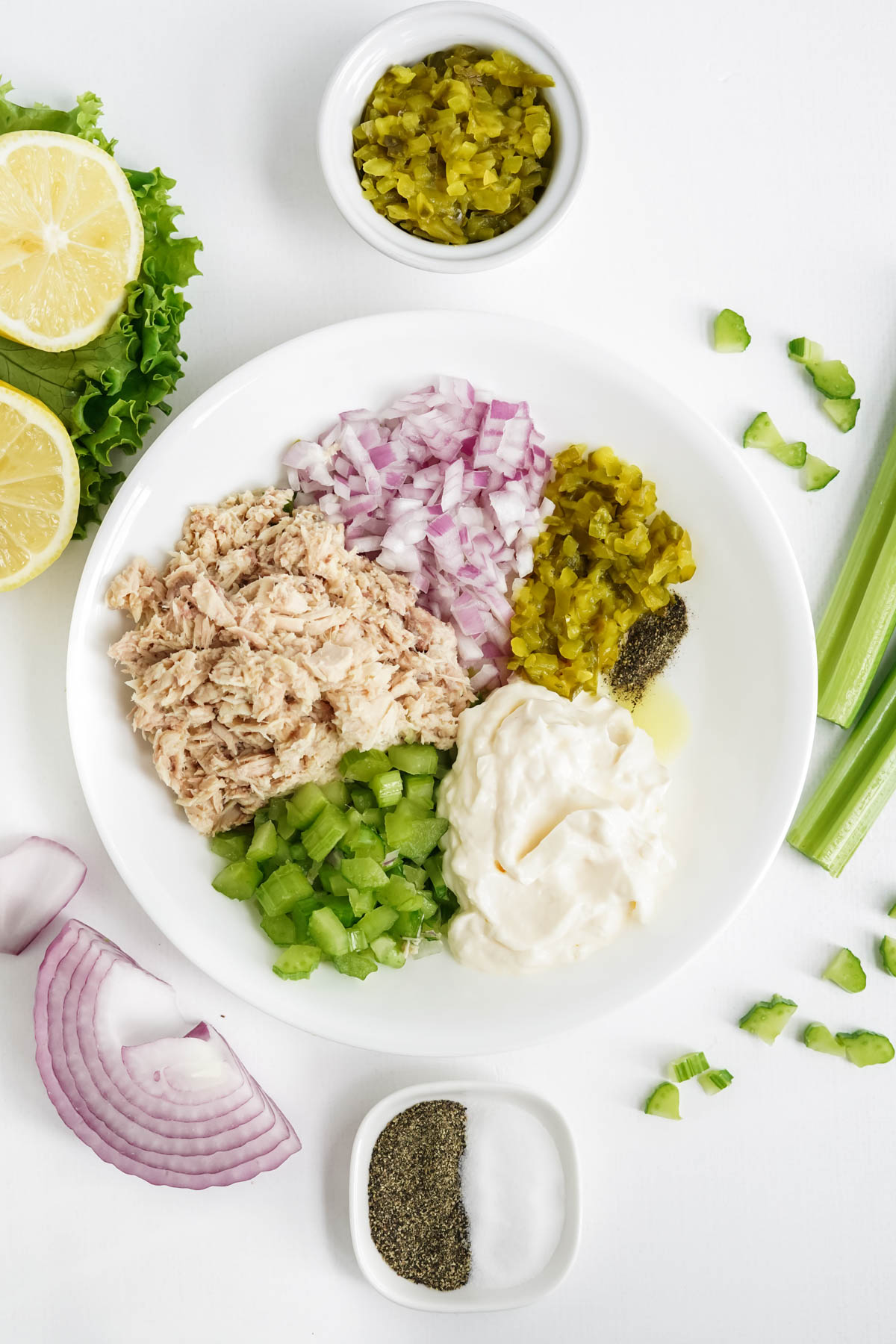 tuna, onions, parsley, mayo, pickles in a bowl