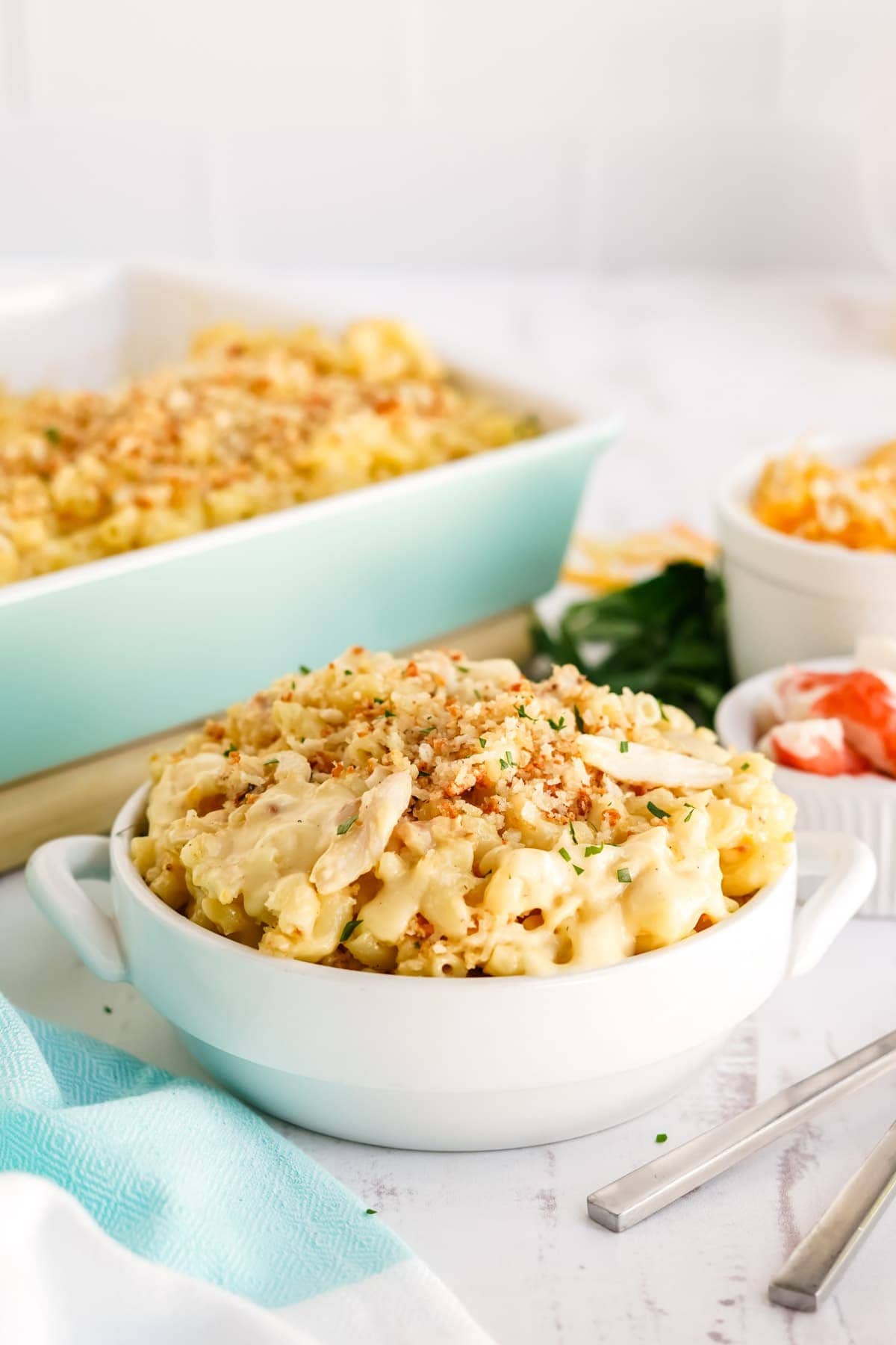 mac and cheese in a white bowl, casserole dish