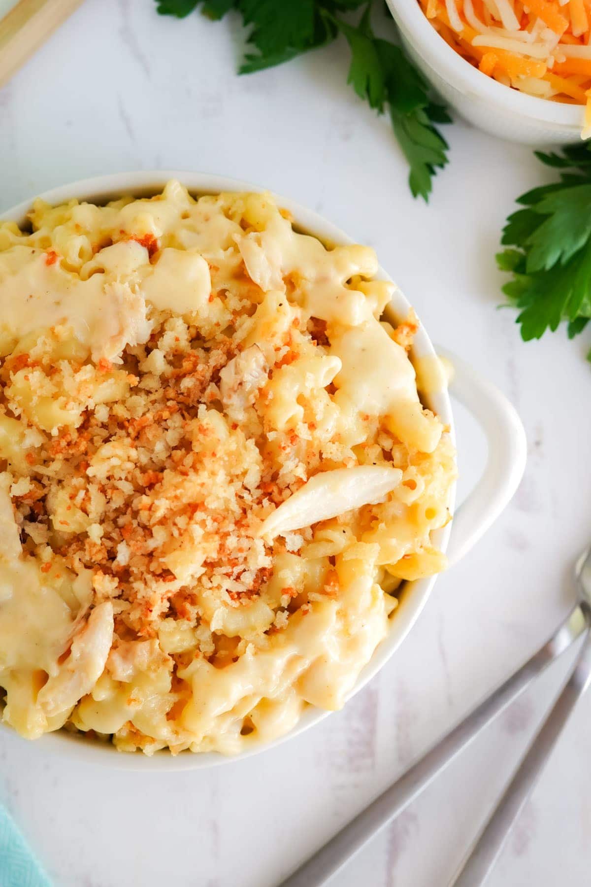 mac and cheese with crab in a bowl with forks
