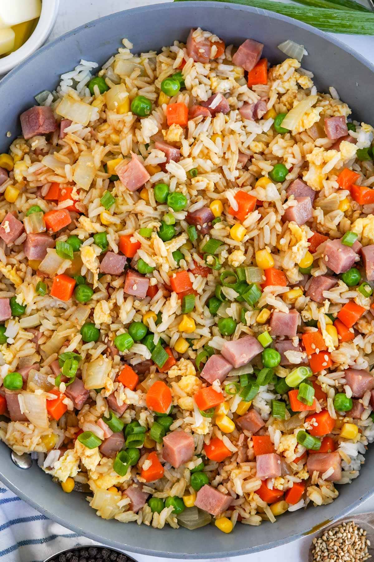 fried rice with ham in a wok