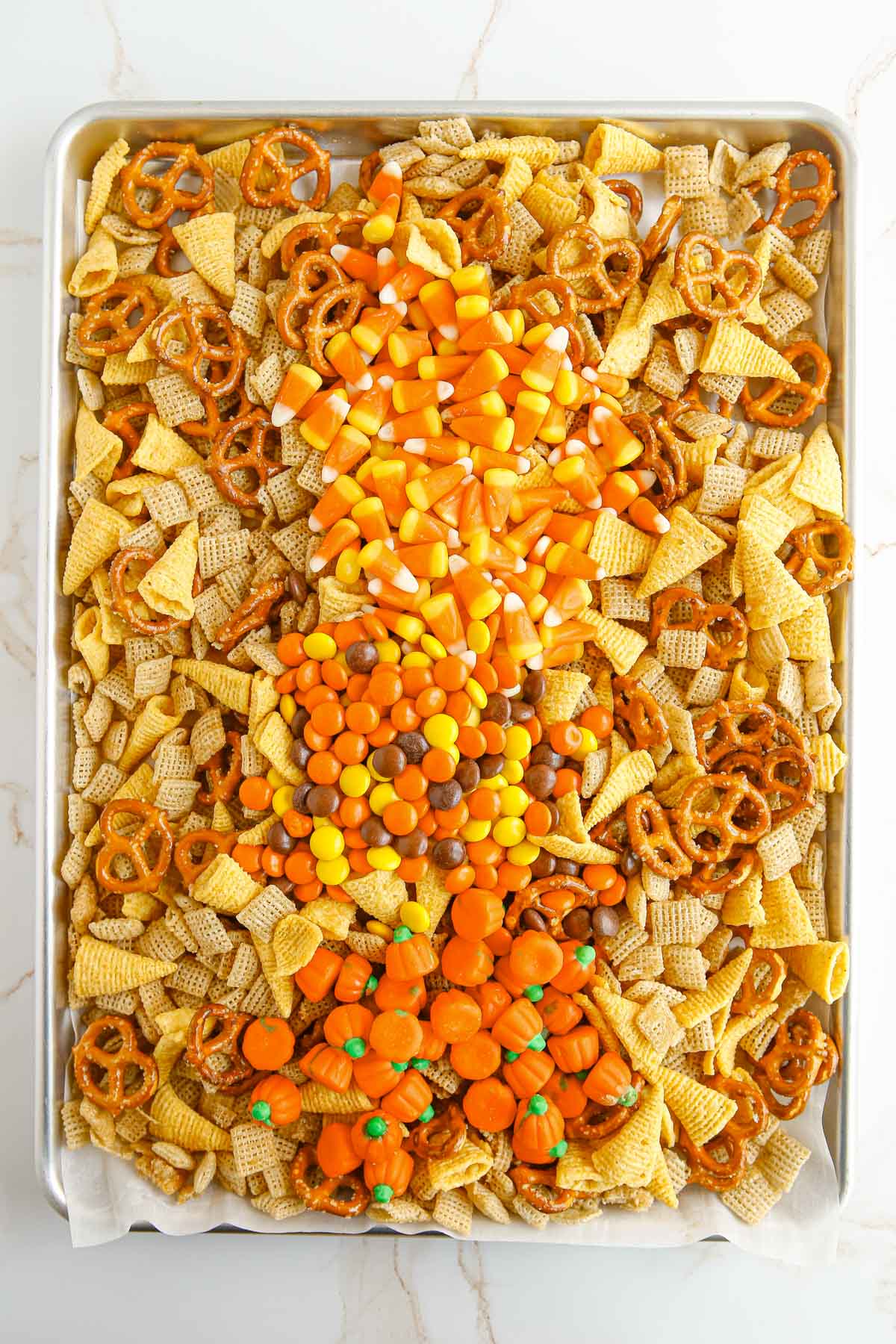 chex mix with candy layered on top