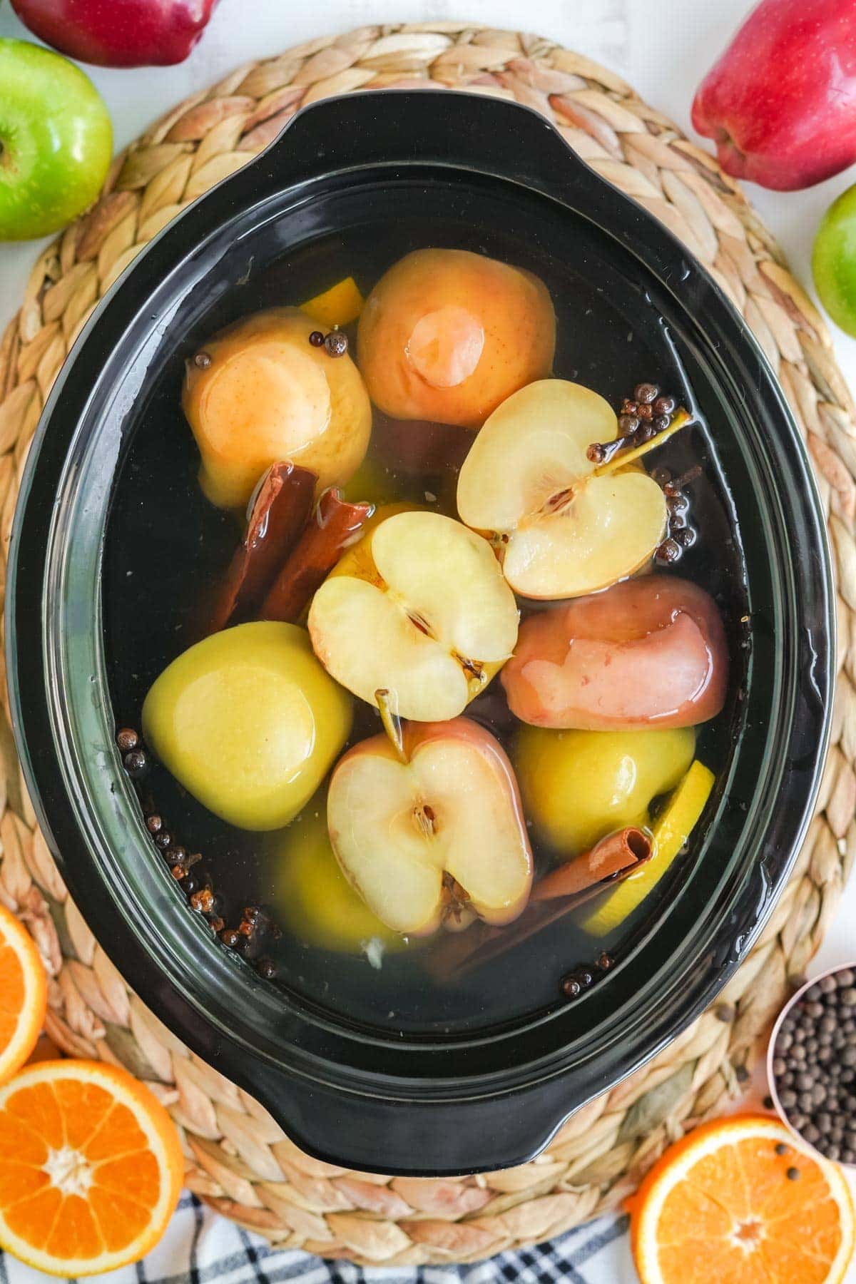 cooked apples in water in a slow cooker