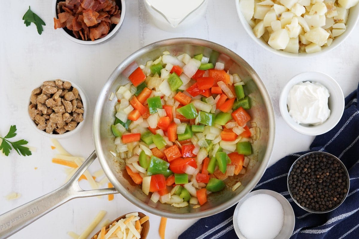 peppers and onions in a frying pan