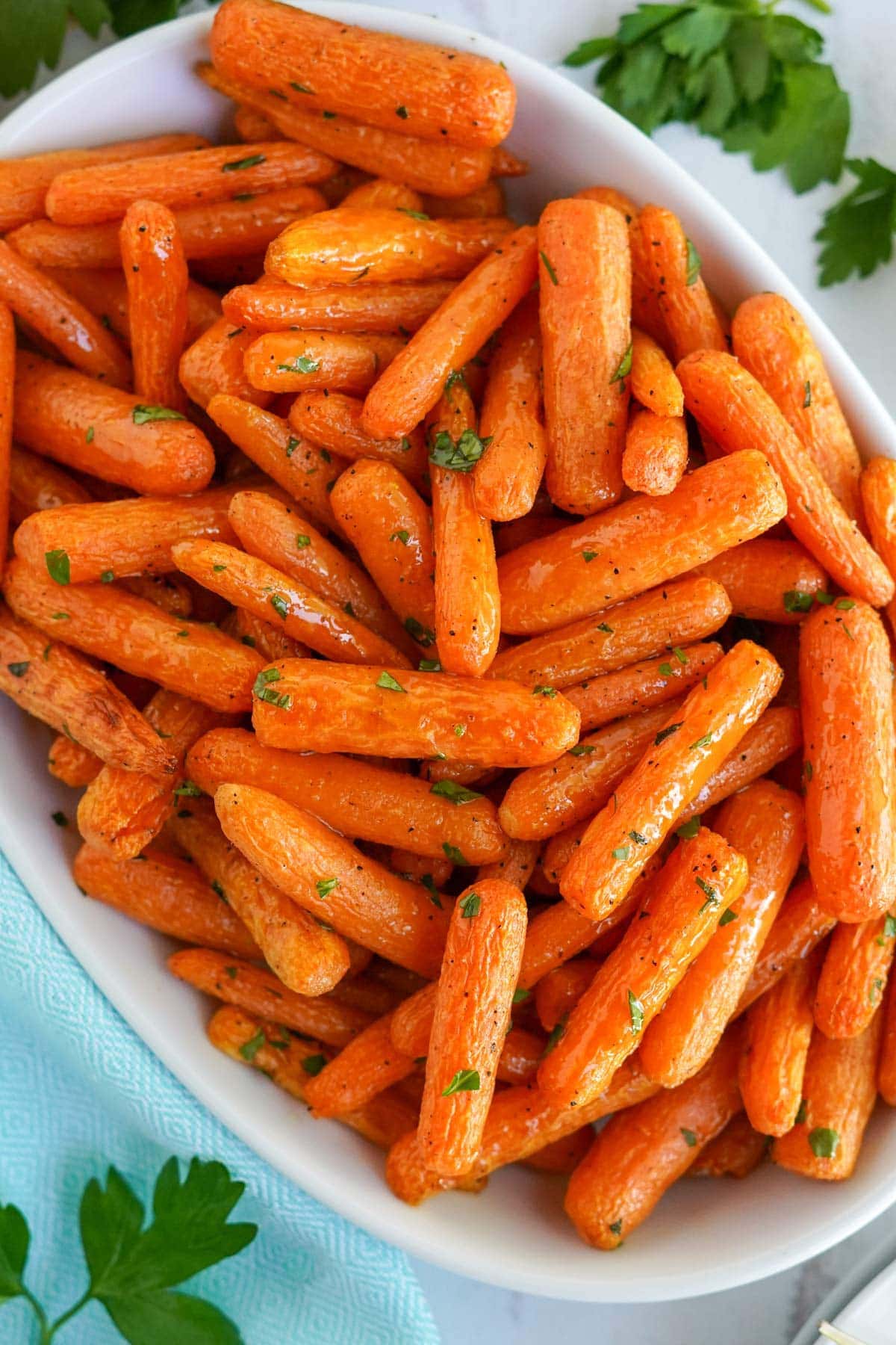 baby carrots in a large white dish