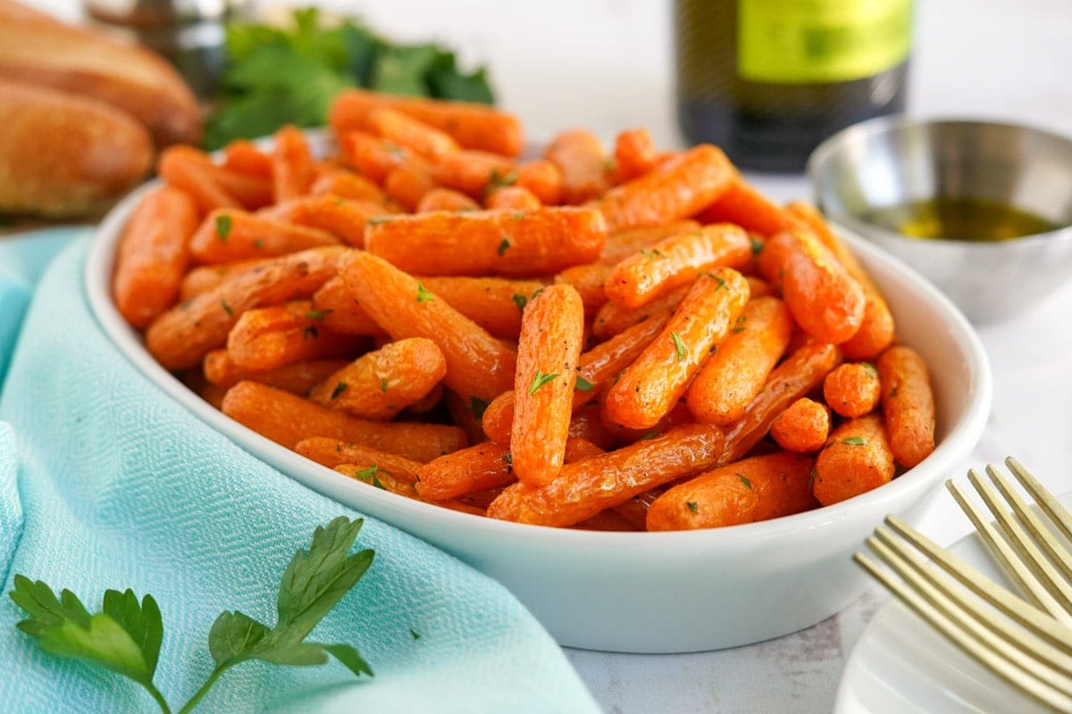 air fryer carrots, white dish, blue napkin