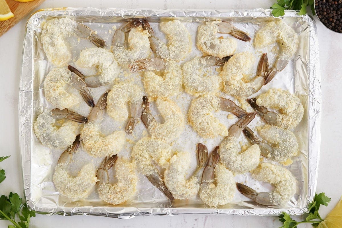 parmesan shrimp on a baking sheet