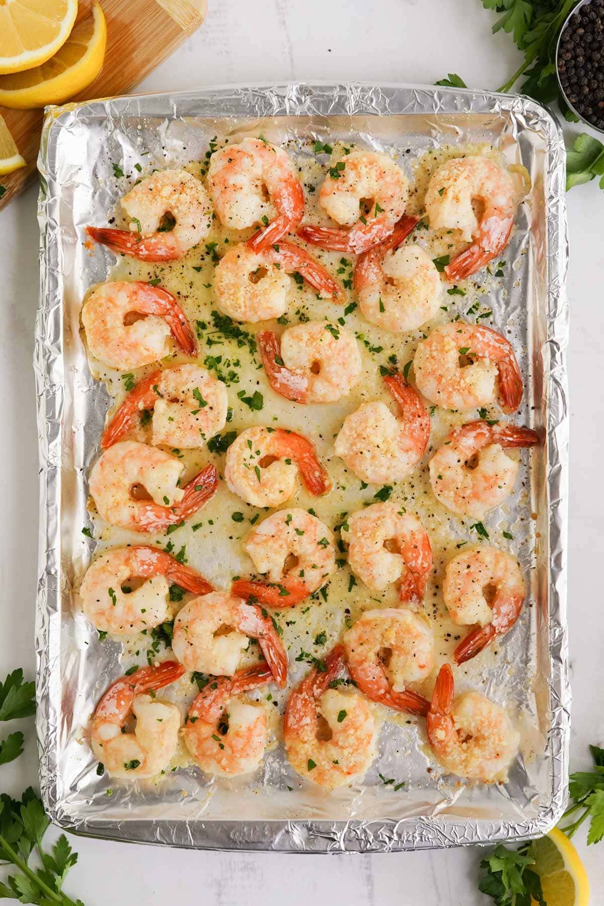 parmesan baked shrimp on a foil lined sheet