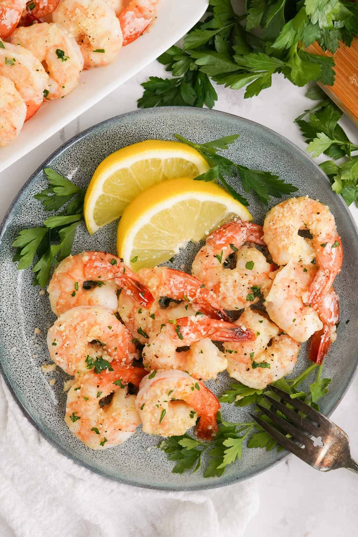 parmesan baked shrimp on gray plate