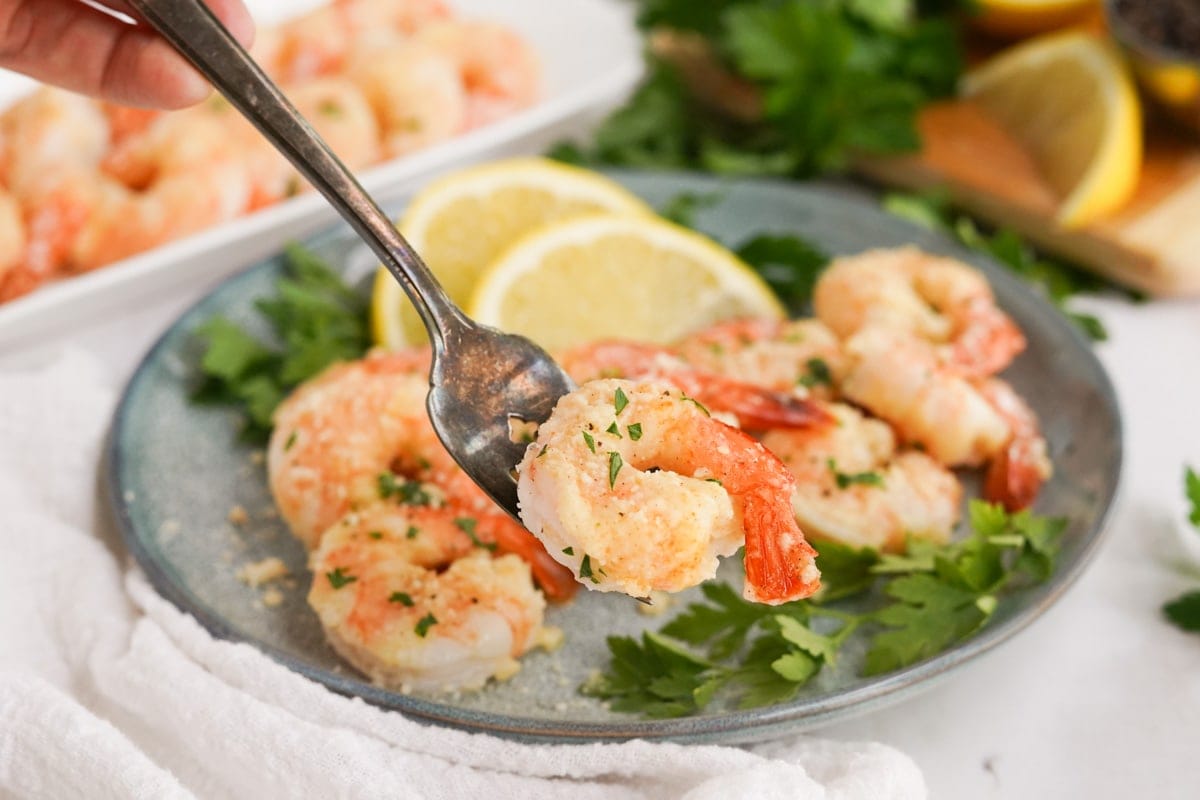shrimp on a gray plate with a fork