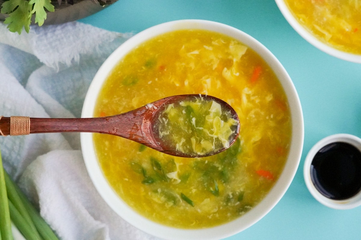 egg drop soup with camera focused on a spoonful of spou