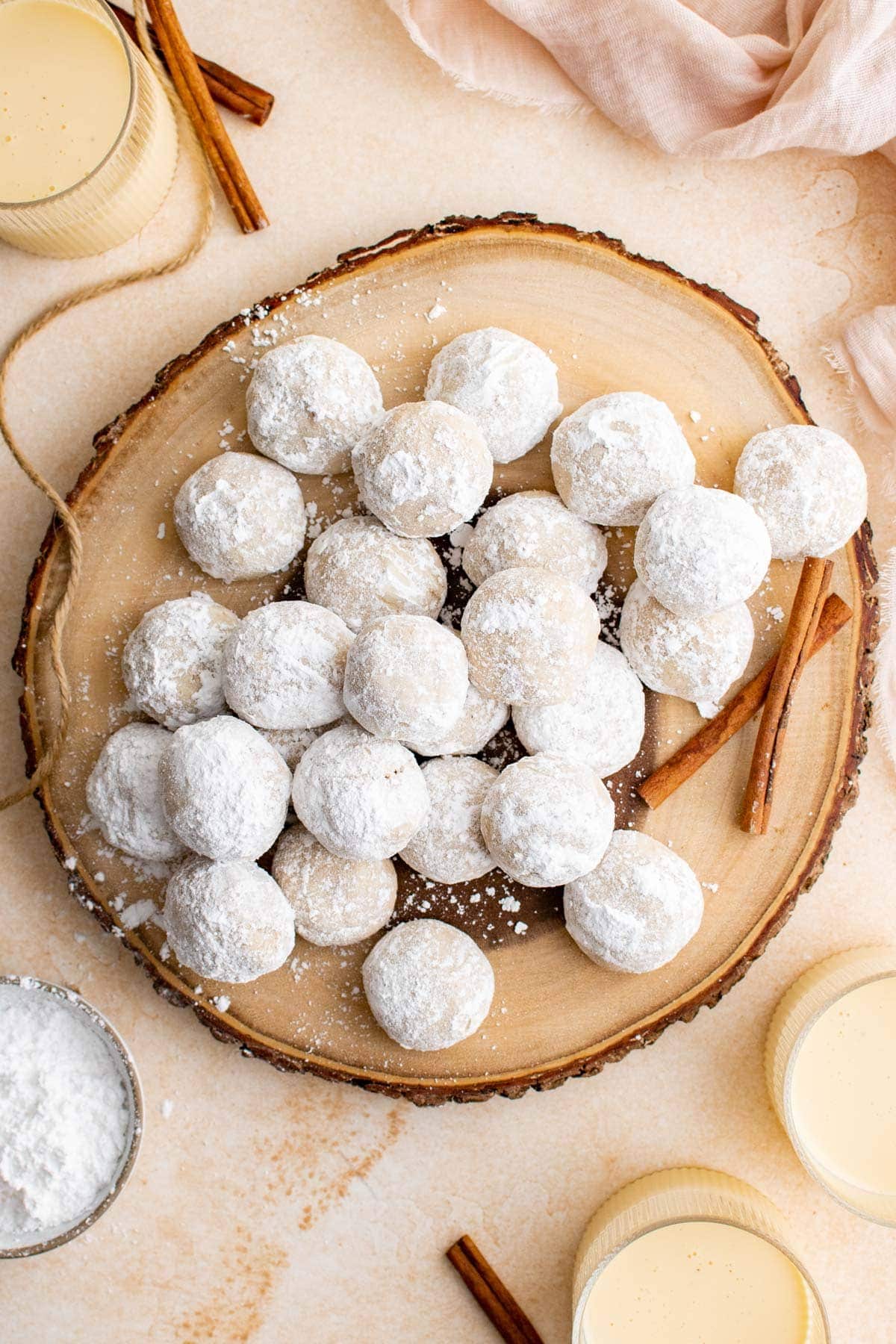 stack of eggnog cookies on a woood tray