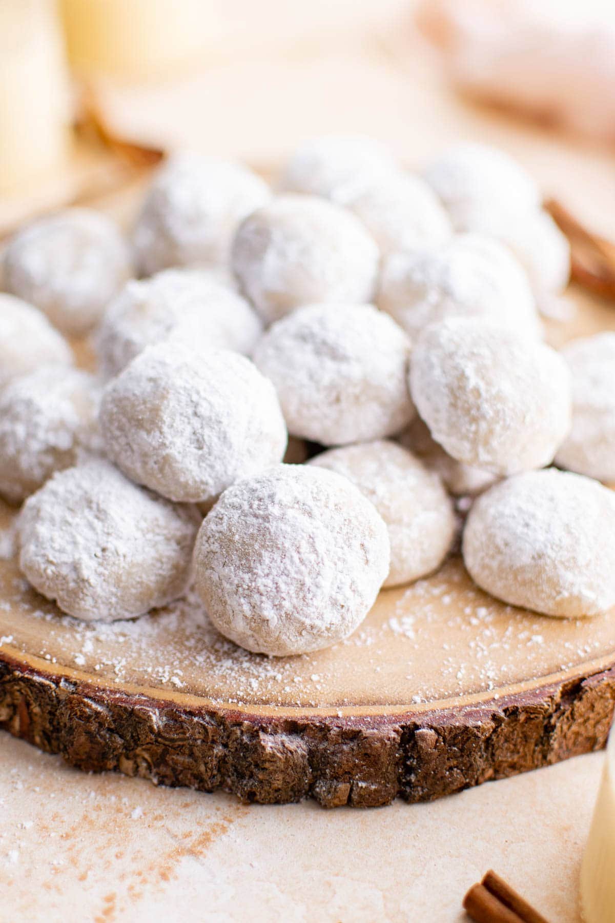 stack of eggnog cookies on a wood plate