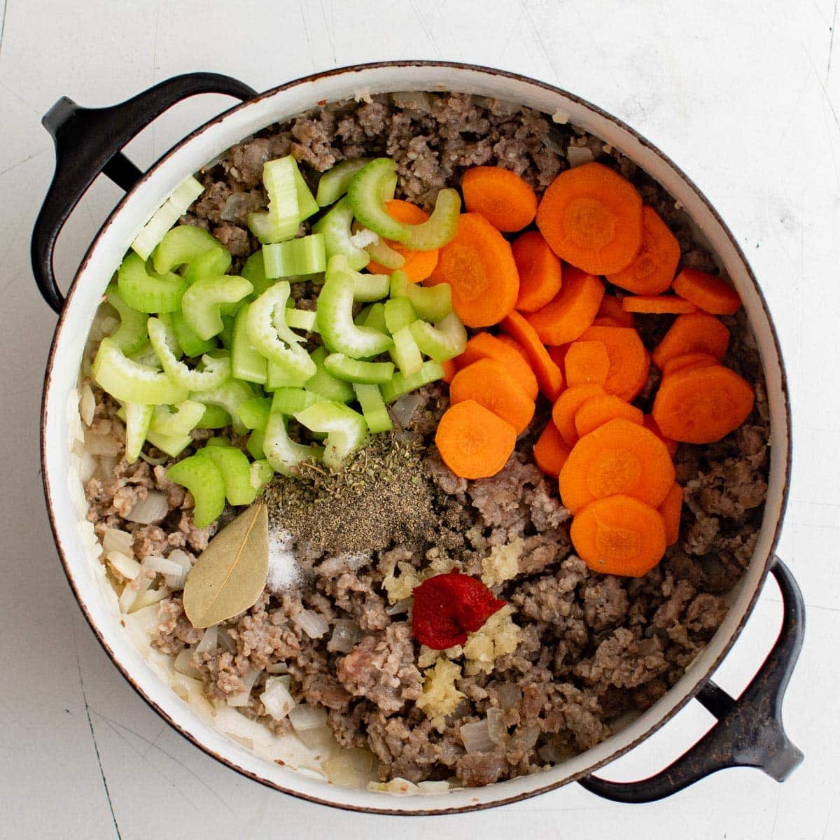 cooked sausage, carrots, celery and spices