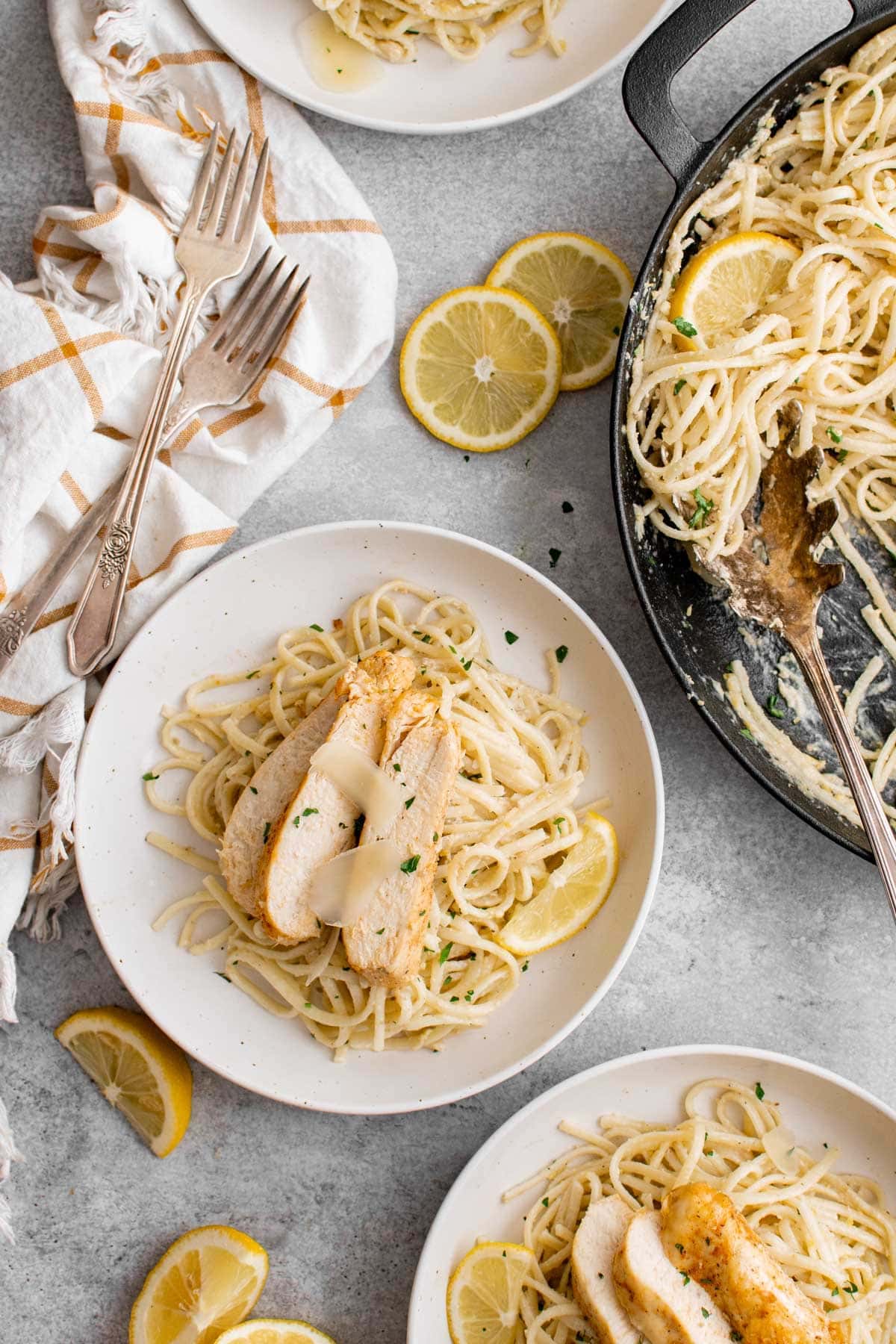 pasta with creamy lemon butter sauce on a white plate