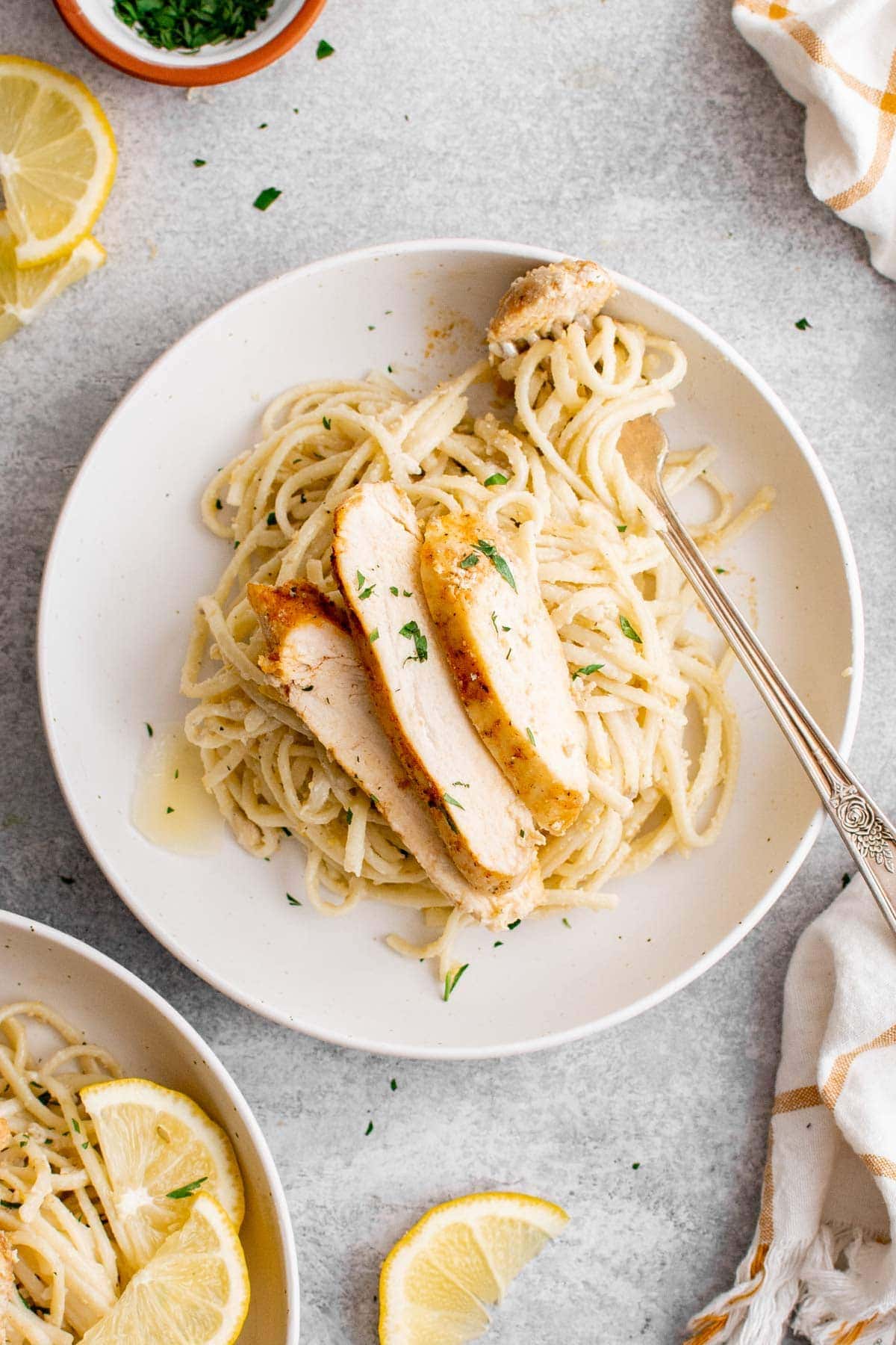 lemon butter pasta with chicken and a fork