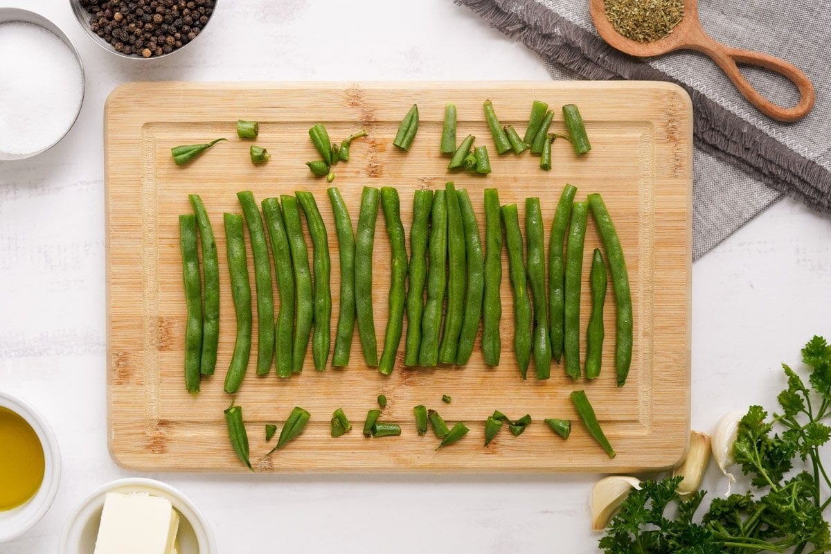 cut green beans on a cutting board