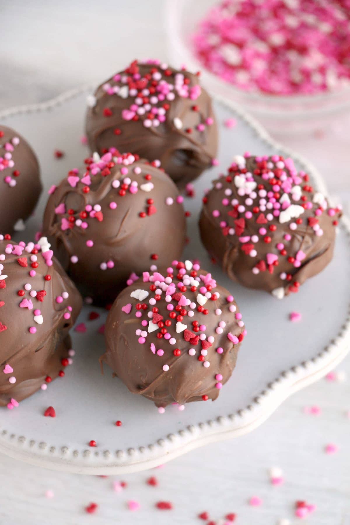 valentine's chocolat cake balls on a cake stand