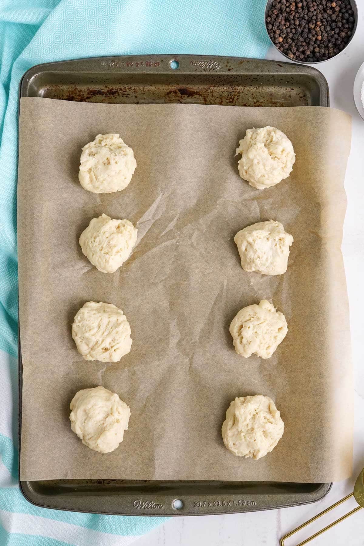biscuit dough dropped on a cookie sheet