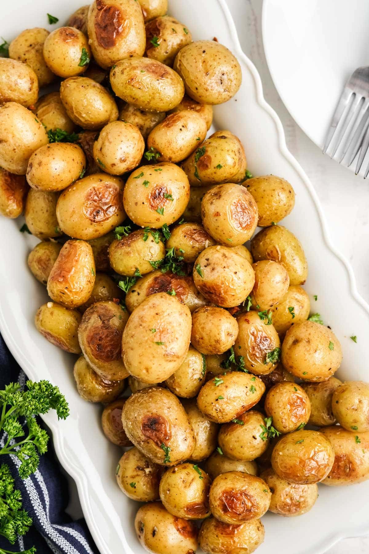 roasted baby potatoes on a white platter