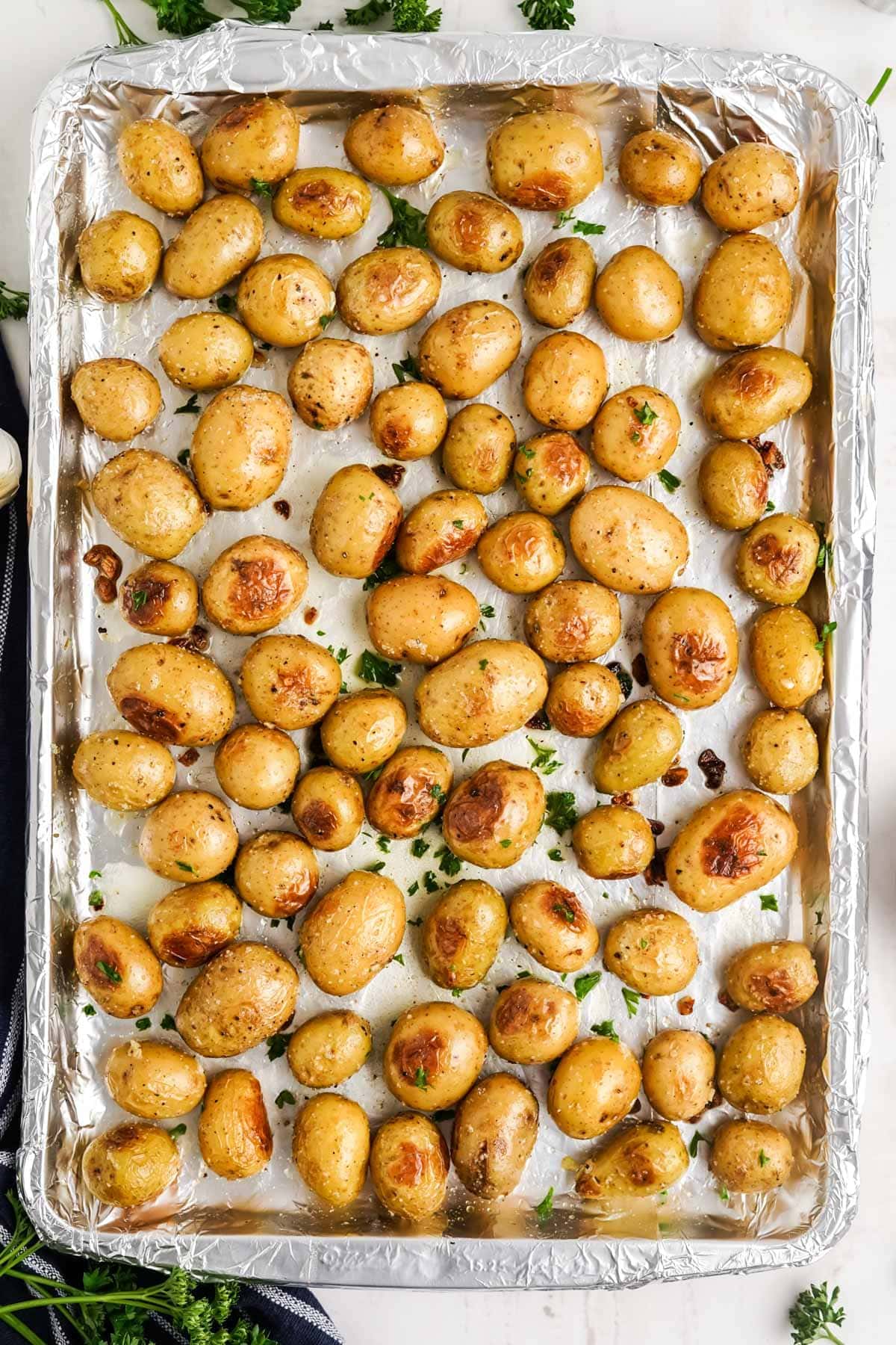 baby potatoes on a baking sheet after being roasted