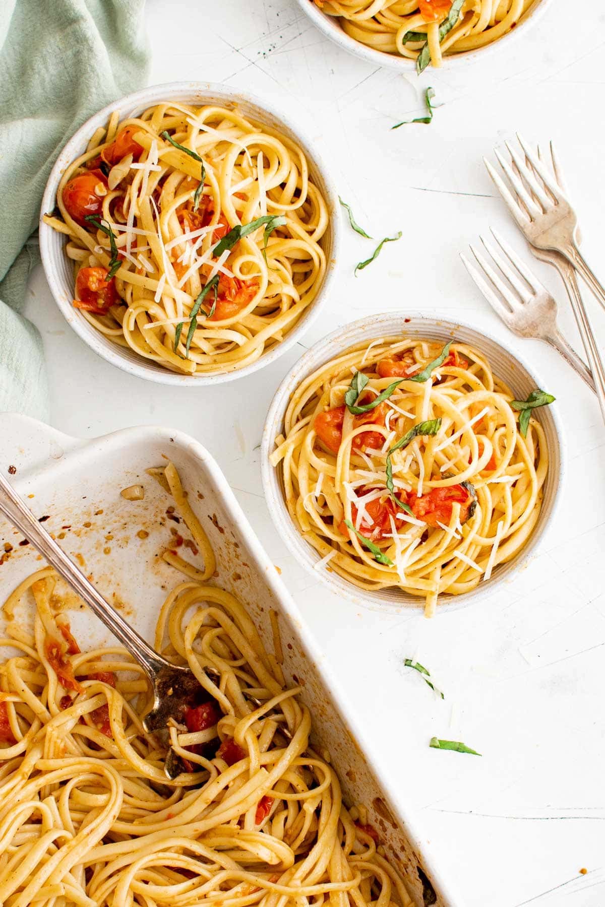 two bowls of pasta with tomatoes