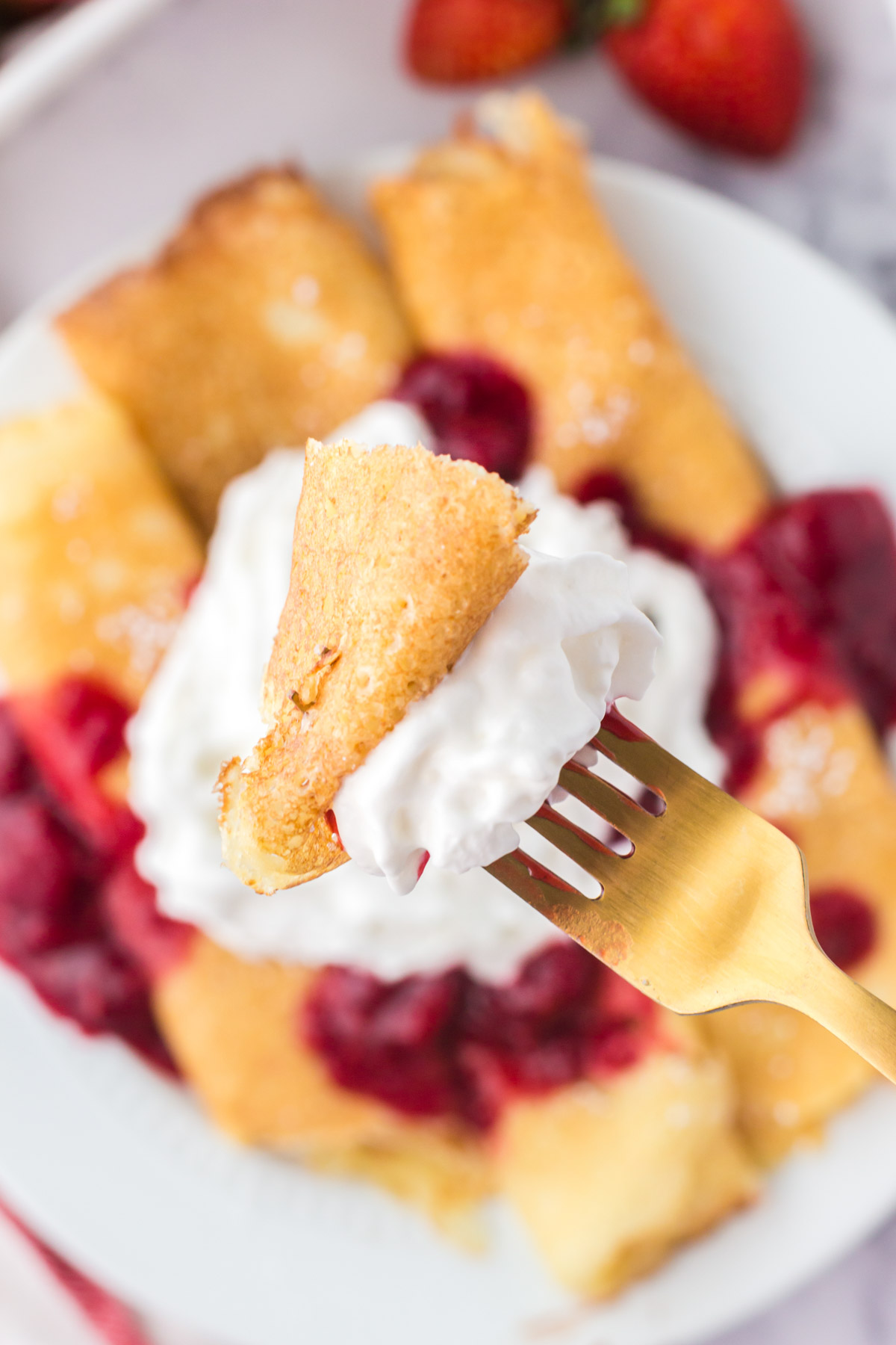 swedish pancakes, on a forn with whipped cream