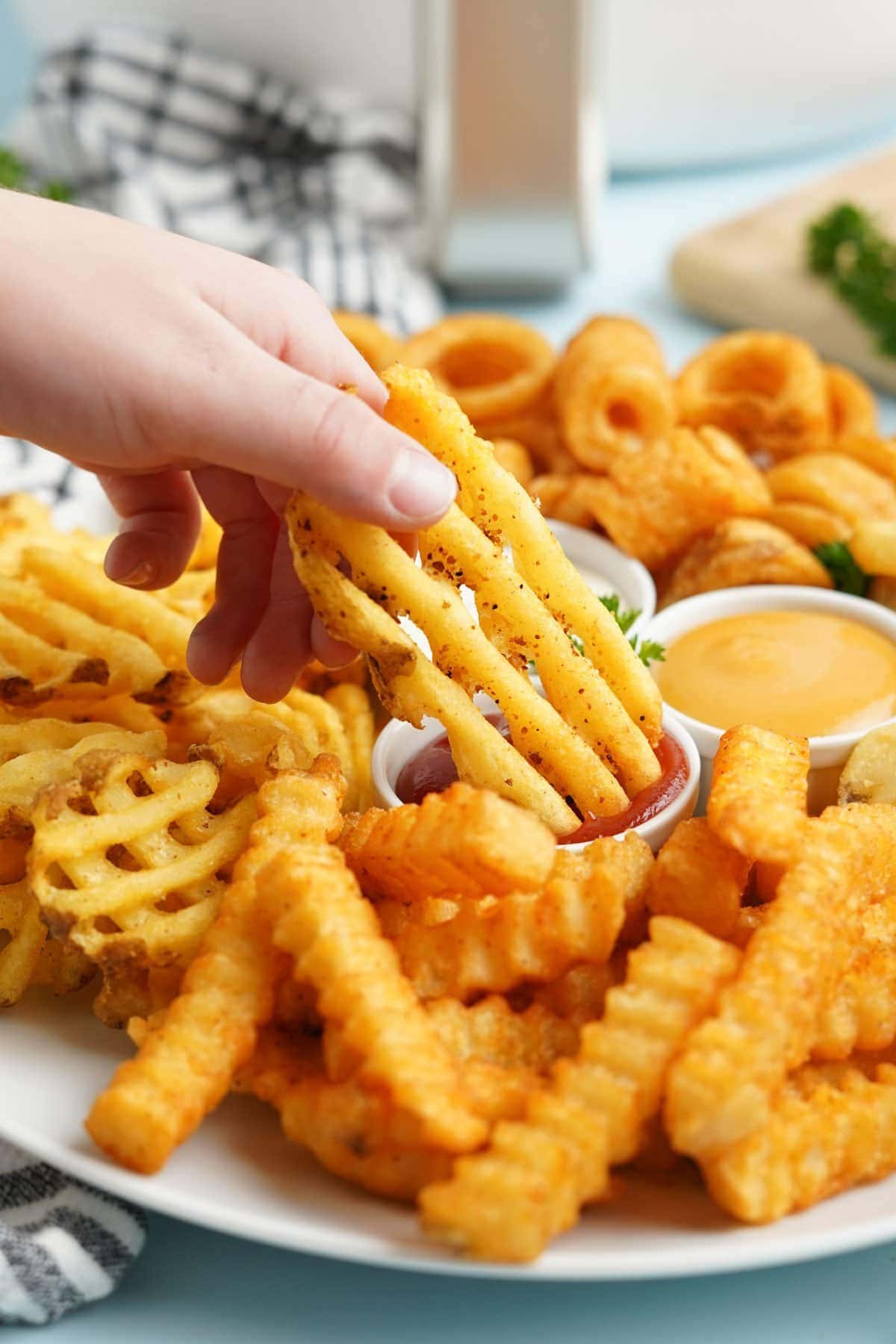 waffle fry dipped in ketchup