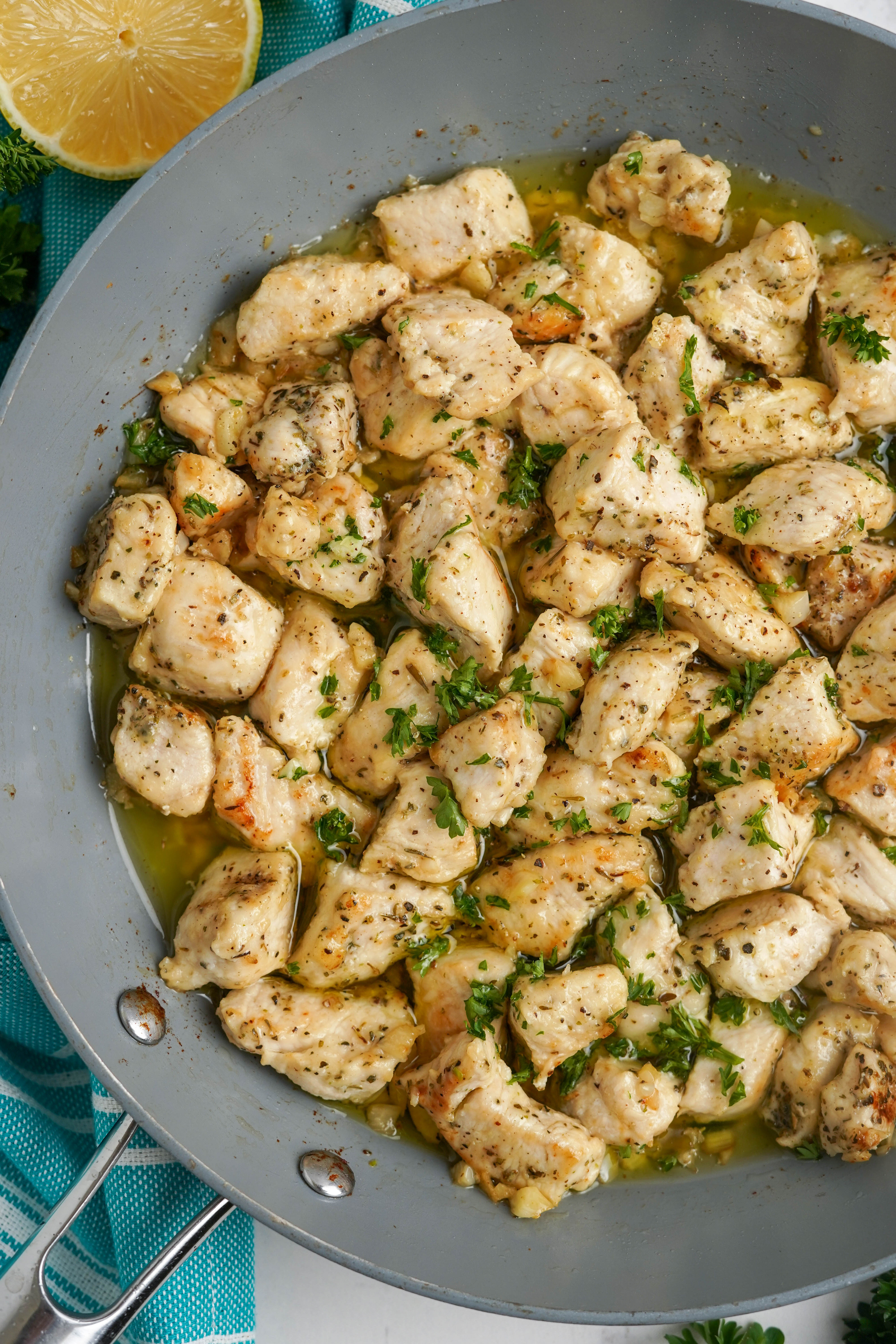 gray skillet with garlic chicken bites in garlic butter