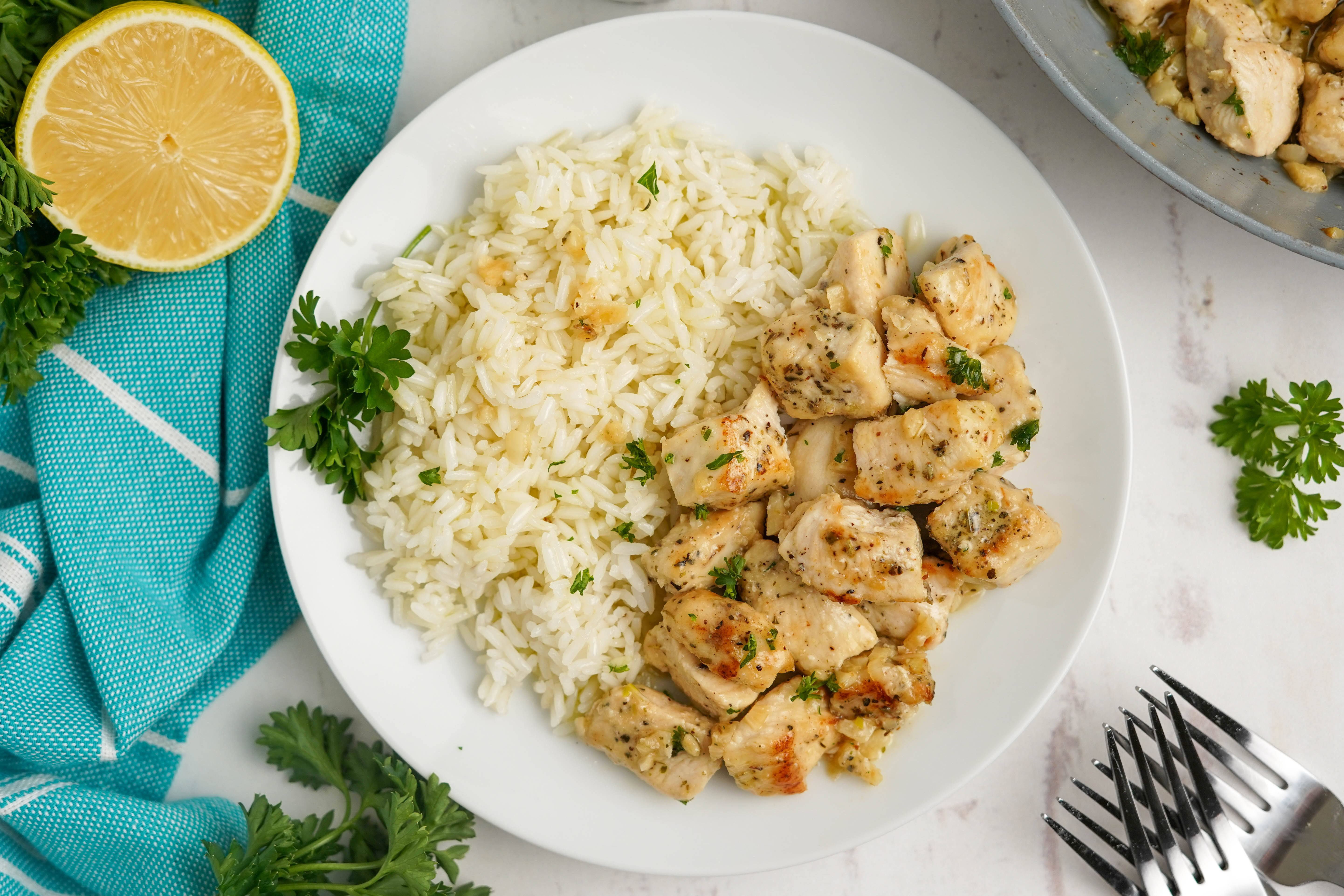 garlic chicken bites and rice on a plate