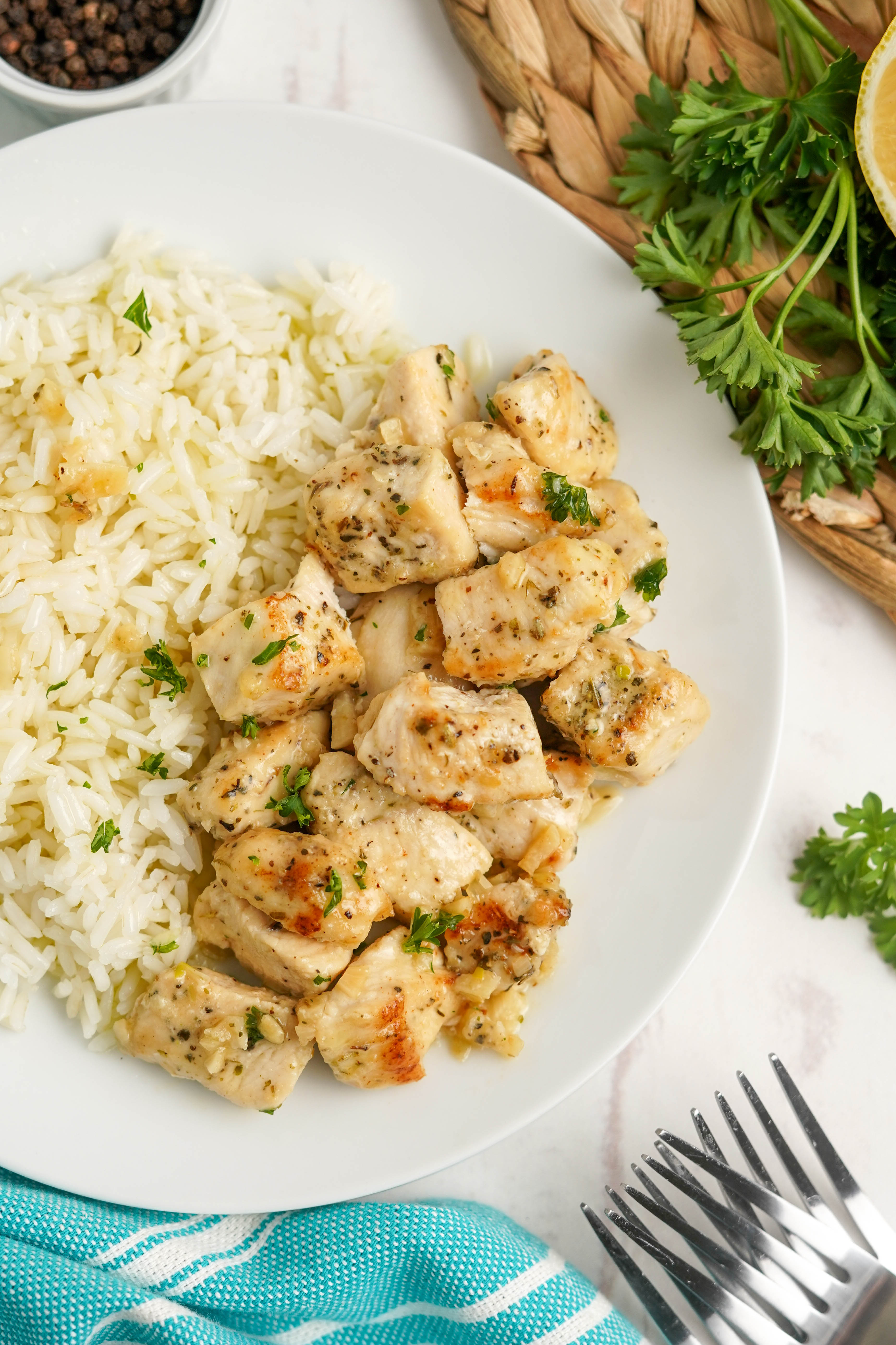 chicken bites and rice on a white plate