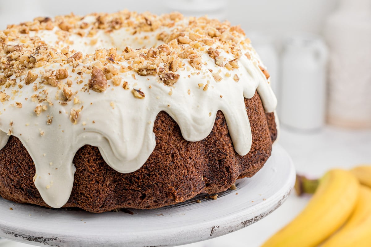 side view of banana bundt cake, showing the frosting