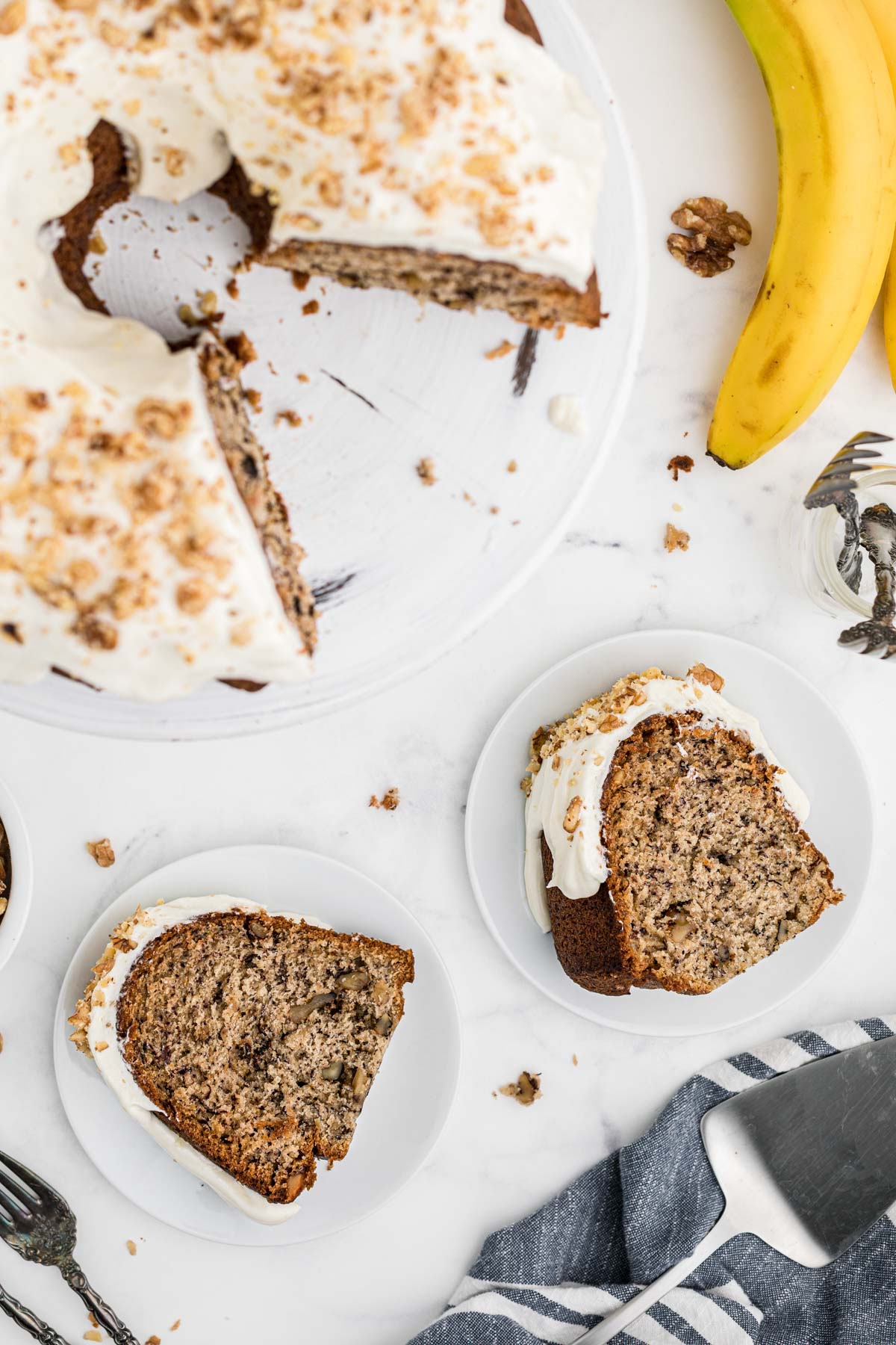 banana bundt cake slices with cream cheese frosting