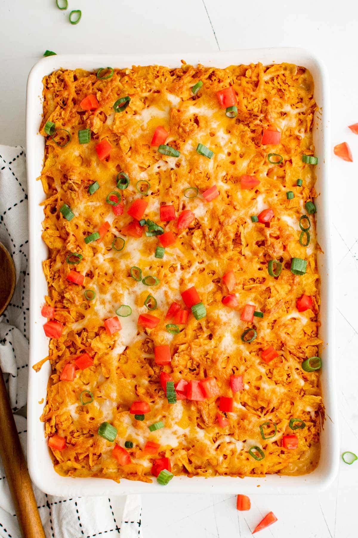 dorito chicken casserole with tomatoes and green onion