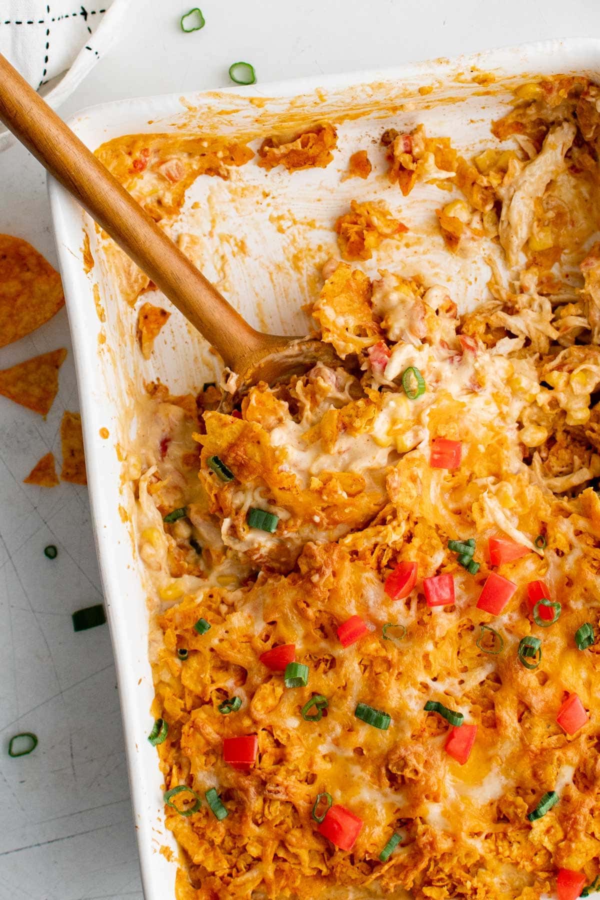 casserole dish and wooden spoon, dorito chicken casserole