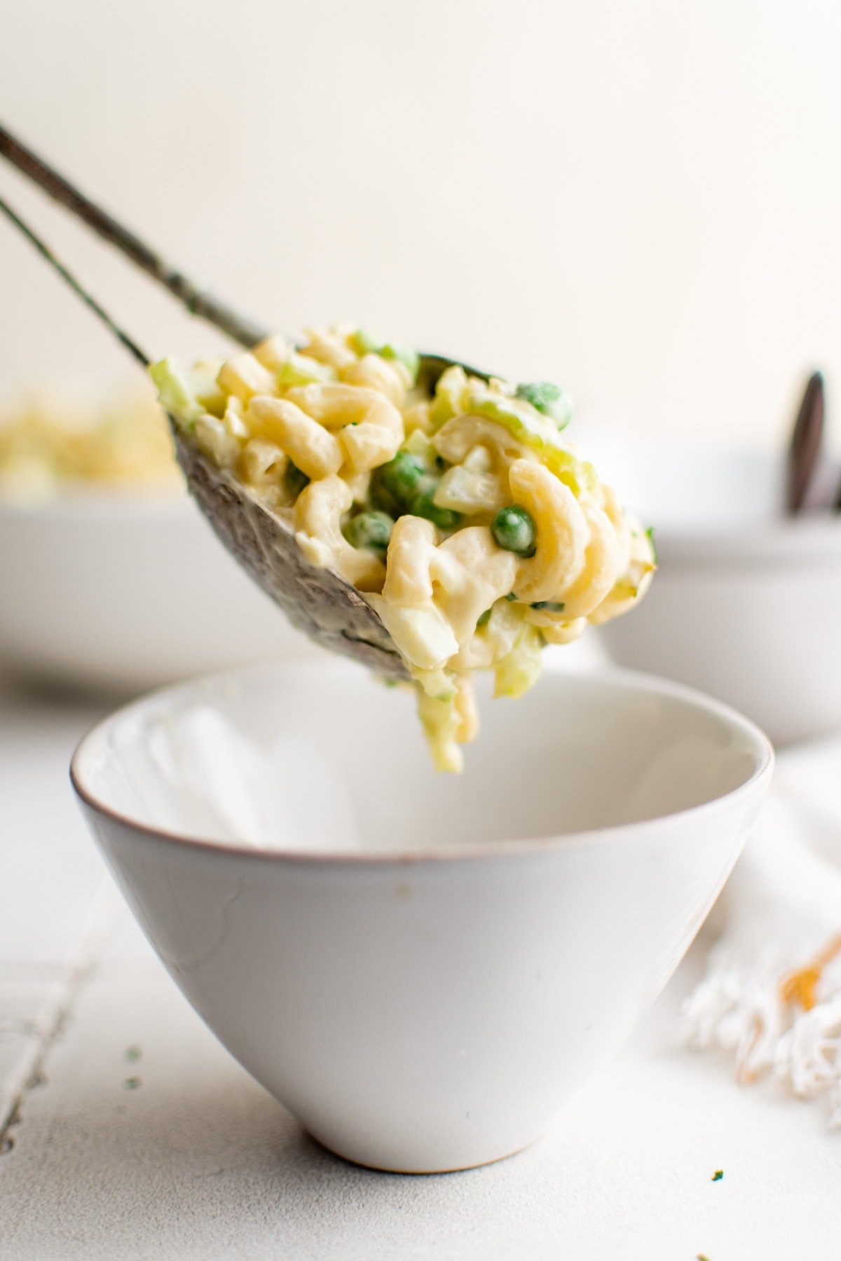 macaroni salad served into a small white bowl