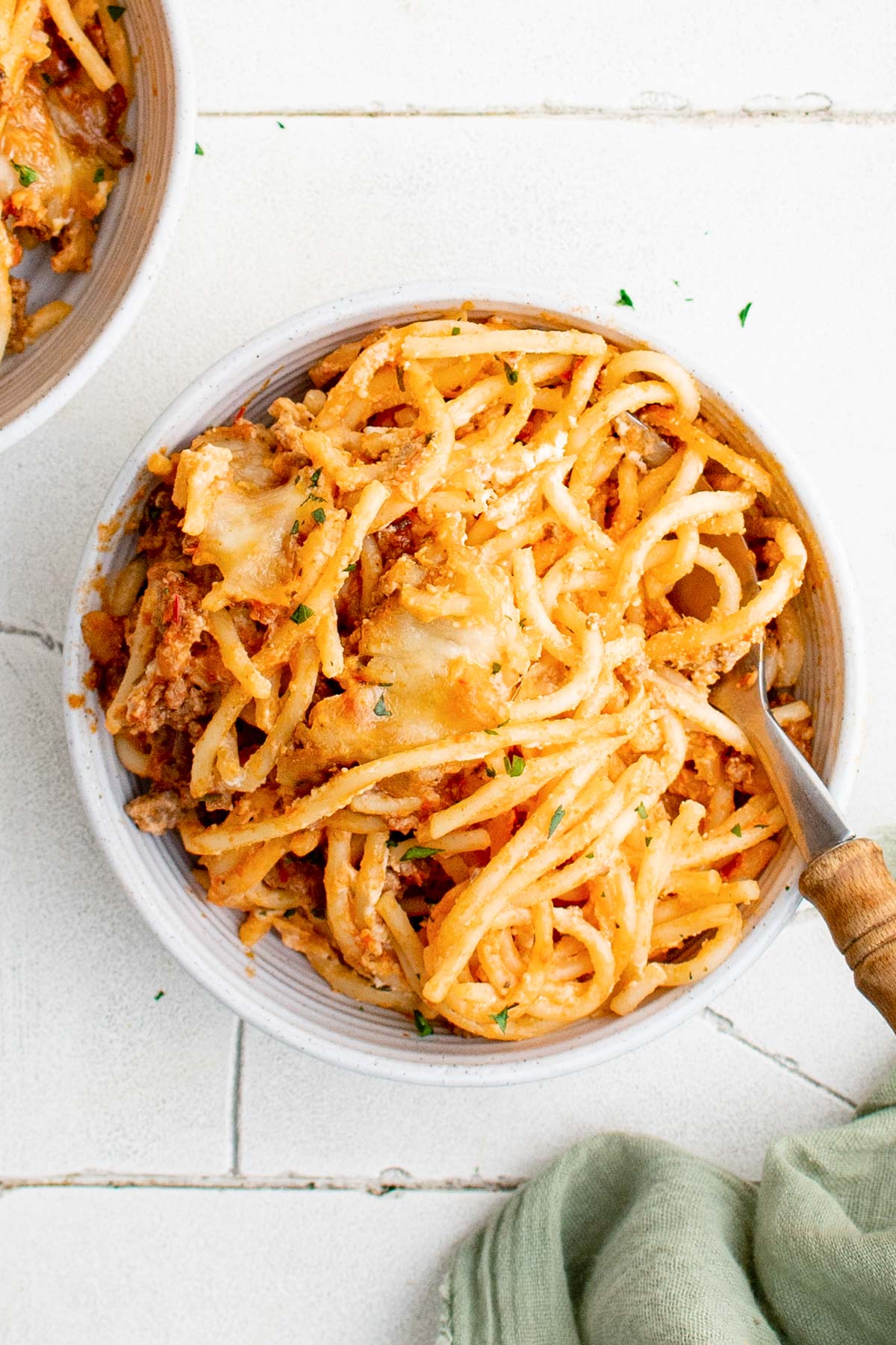 million dollar spaghetti casserole in a bowl with a fork