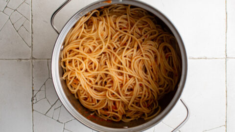 spaghetti in a saucepan with sauce