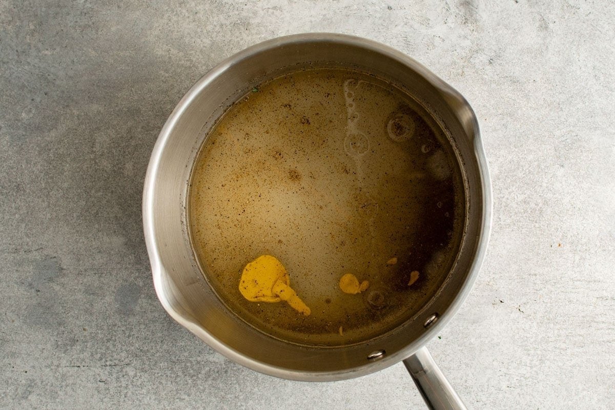 cabbage salad dressing ingredients in a saucepan