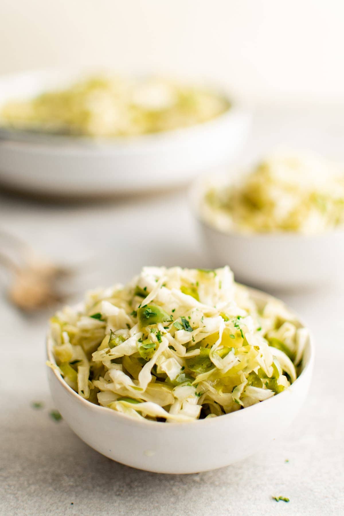 bowls of green cabbage salad