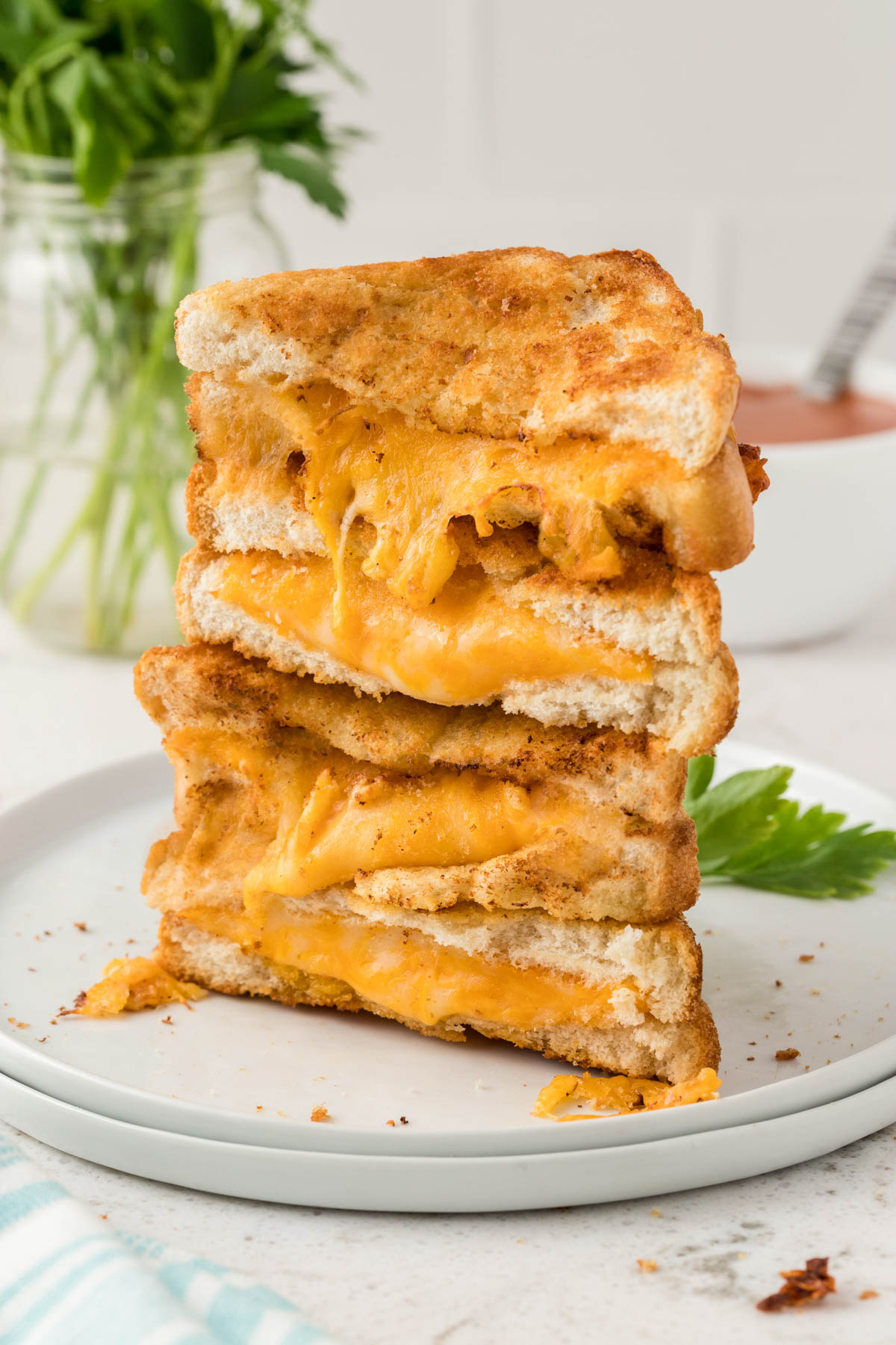 stack of sliced grilled cheese sandwiches